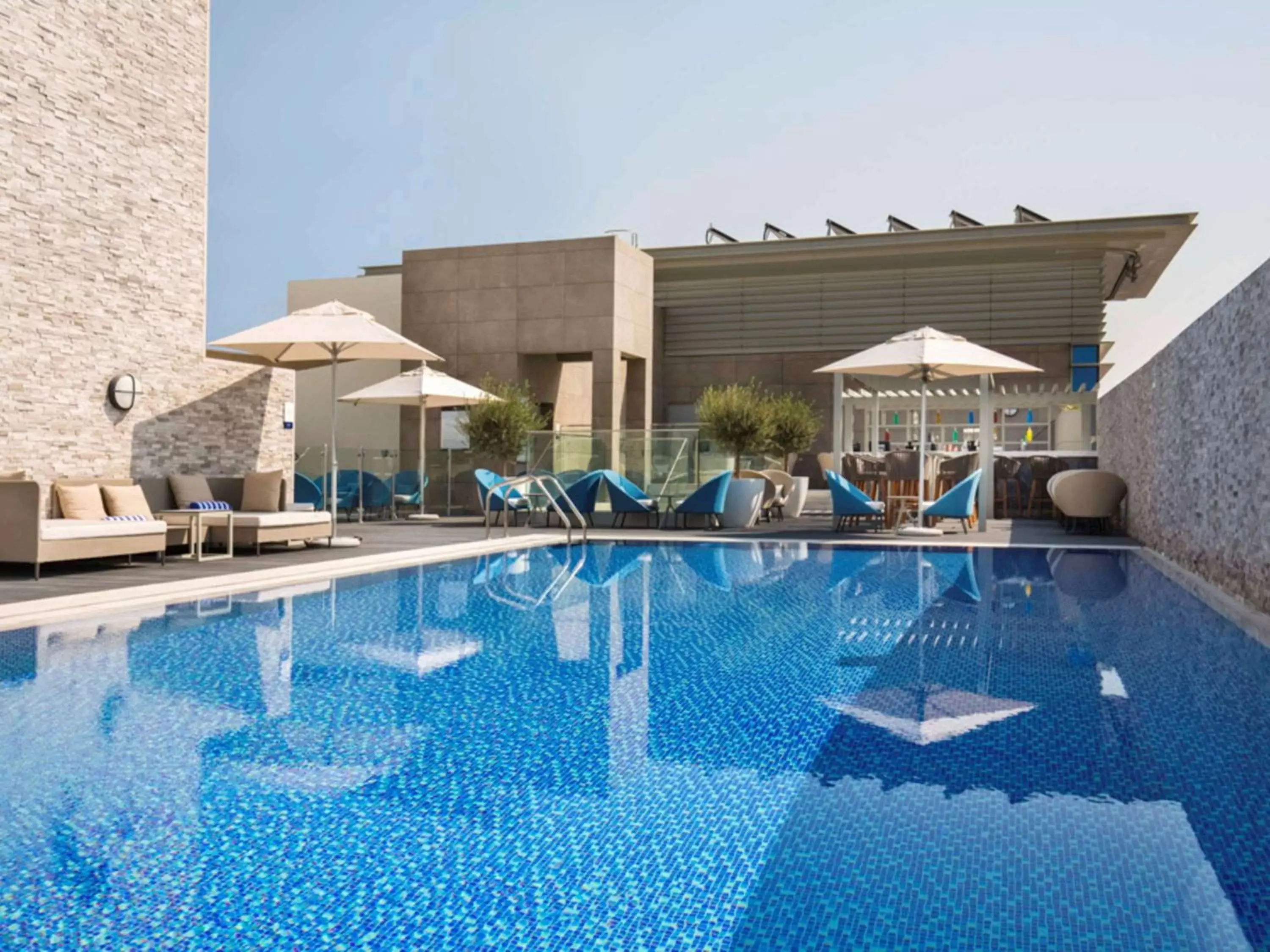 Lounge or bar, Swimming Pool in Novotel Bur Dubai - Healthcare City