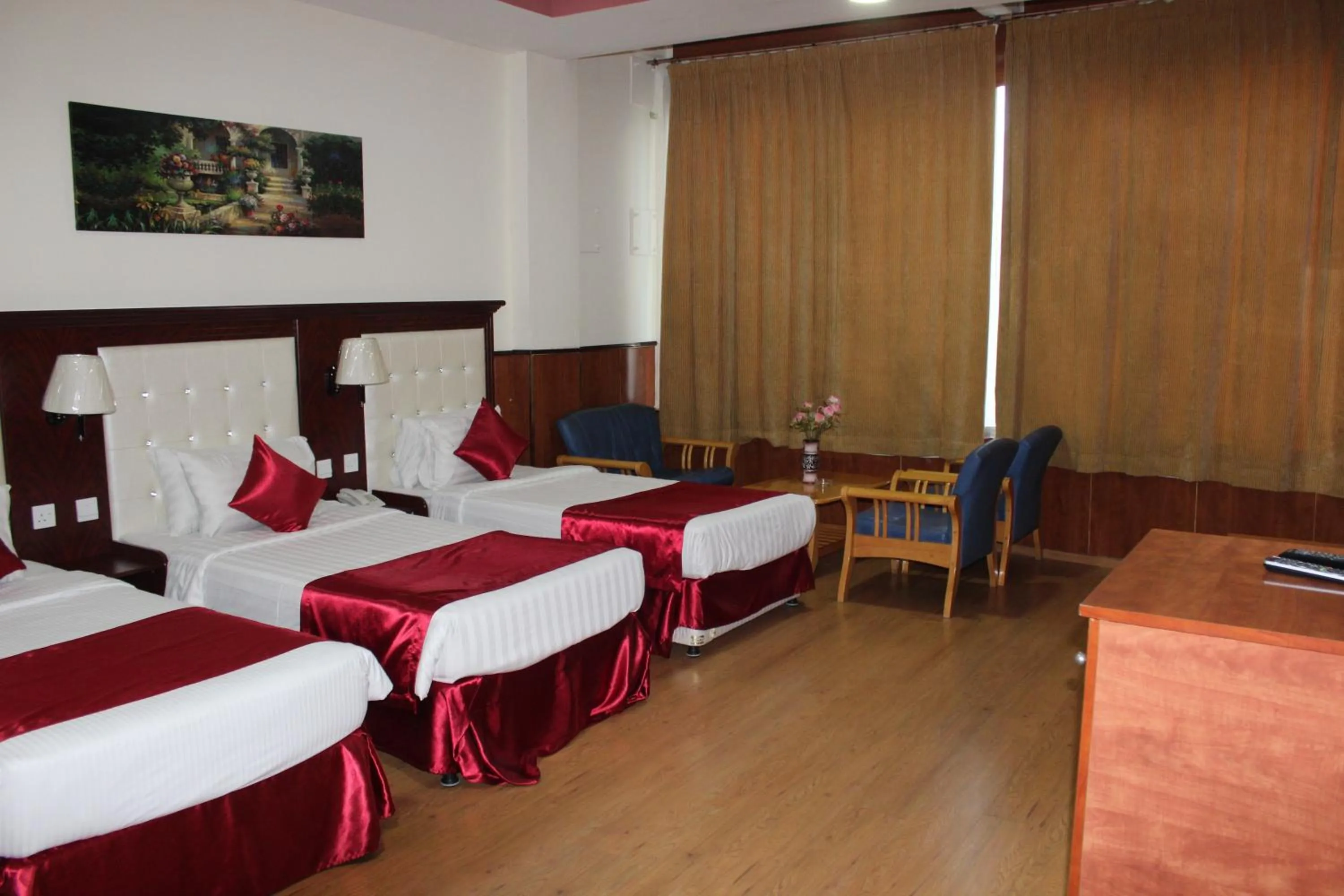 Bed in Grand Nova Hotel