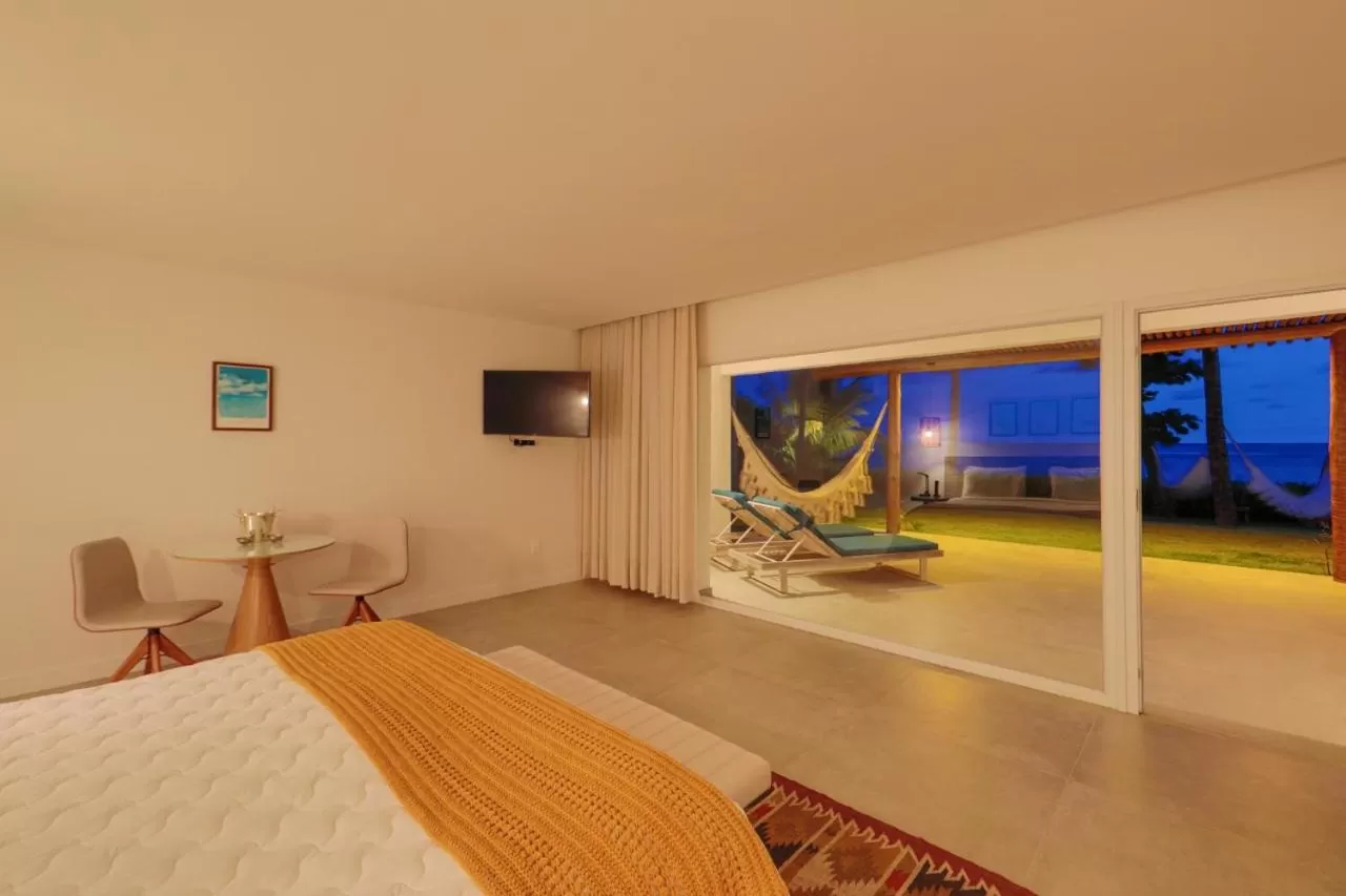 Communal lounge/ TV room, Bed in Pousada Aldeia Beijupirá