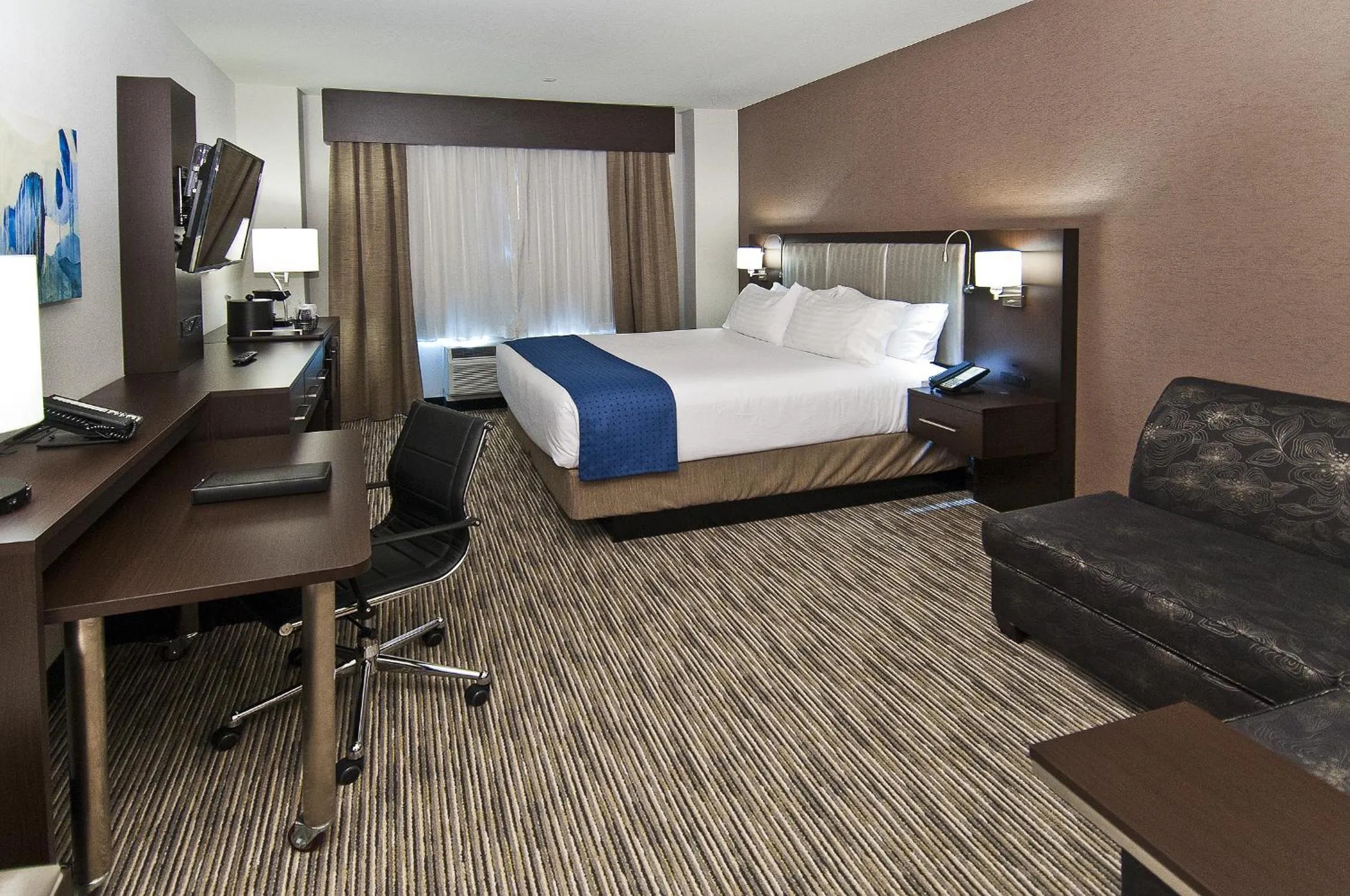 Seating area, Bed in Holiday Inn Austin Airport by IHG