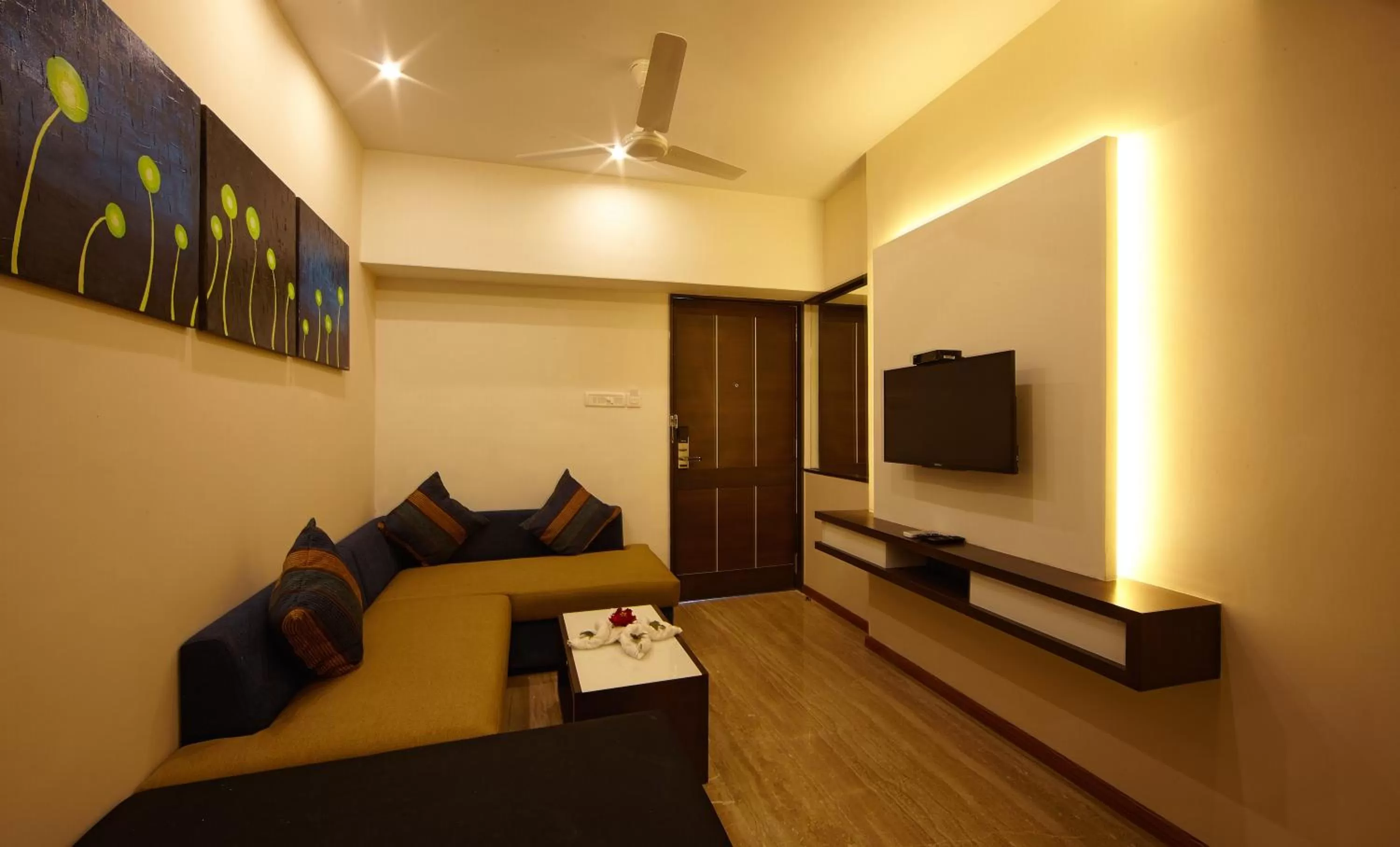 Living room, Bed in Golden Fruits Business Suites