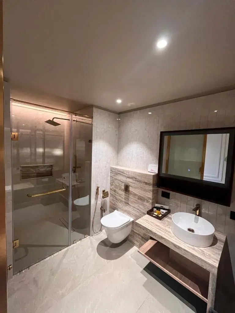Bathroom in Hotel Poonja International