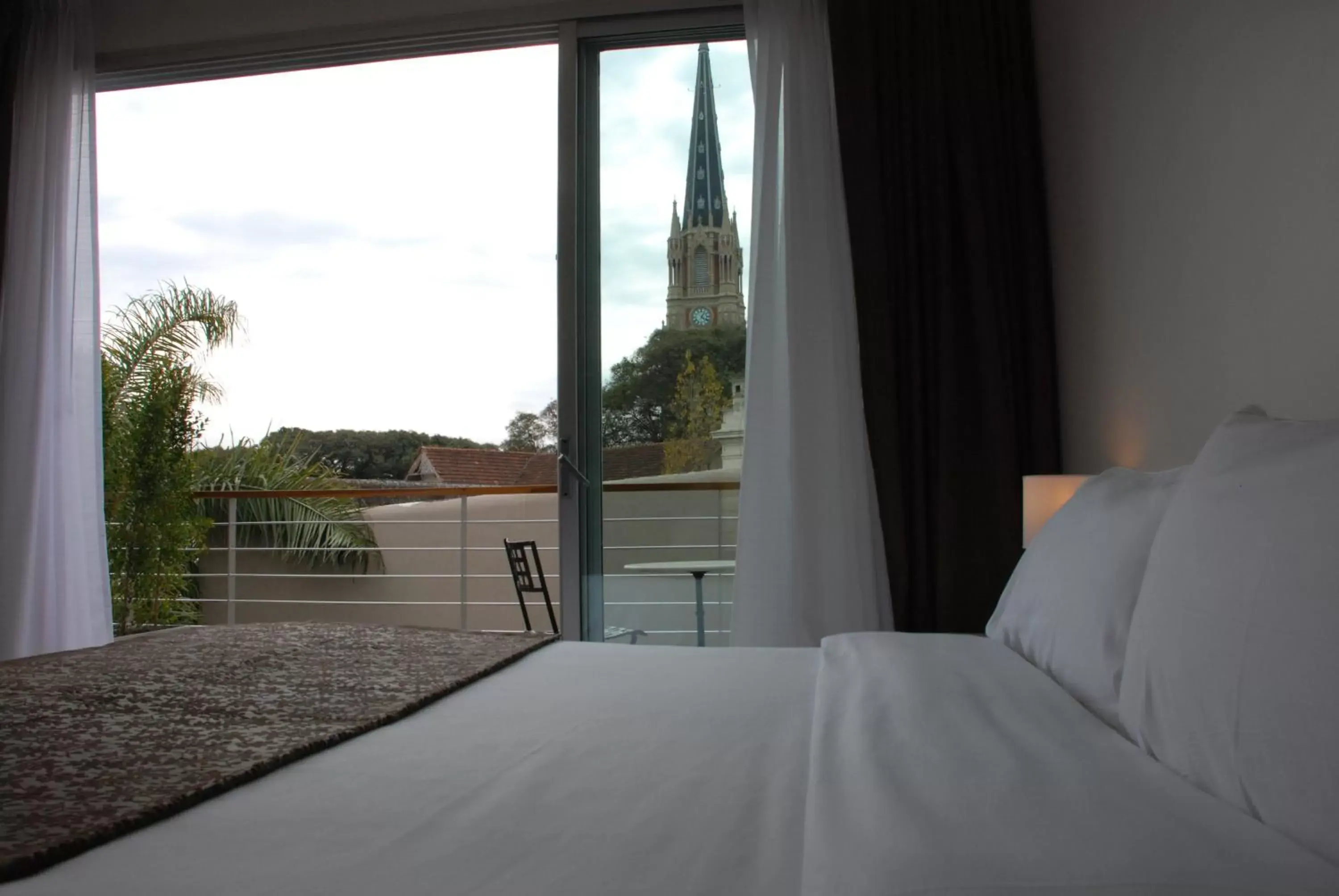 Landmark view, Bed in San Isidro Plaza Hotel