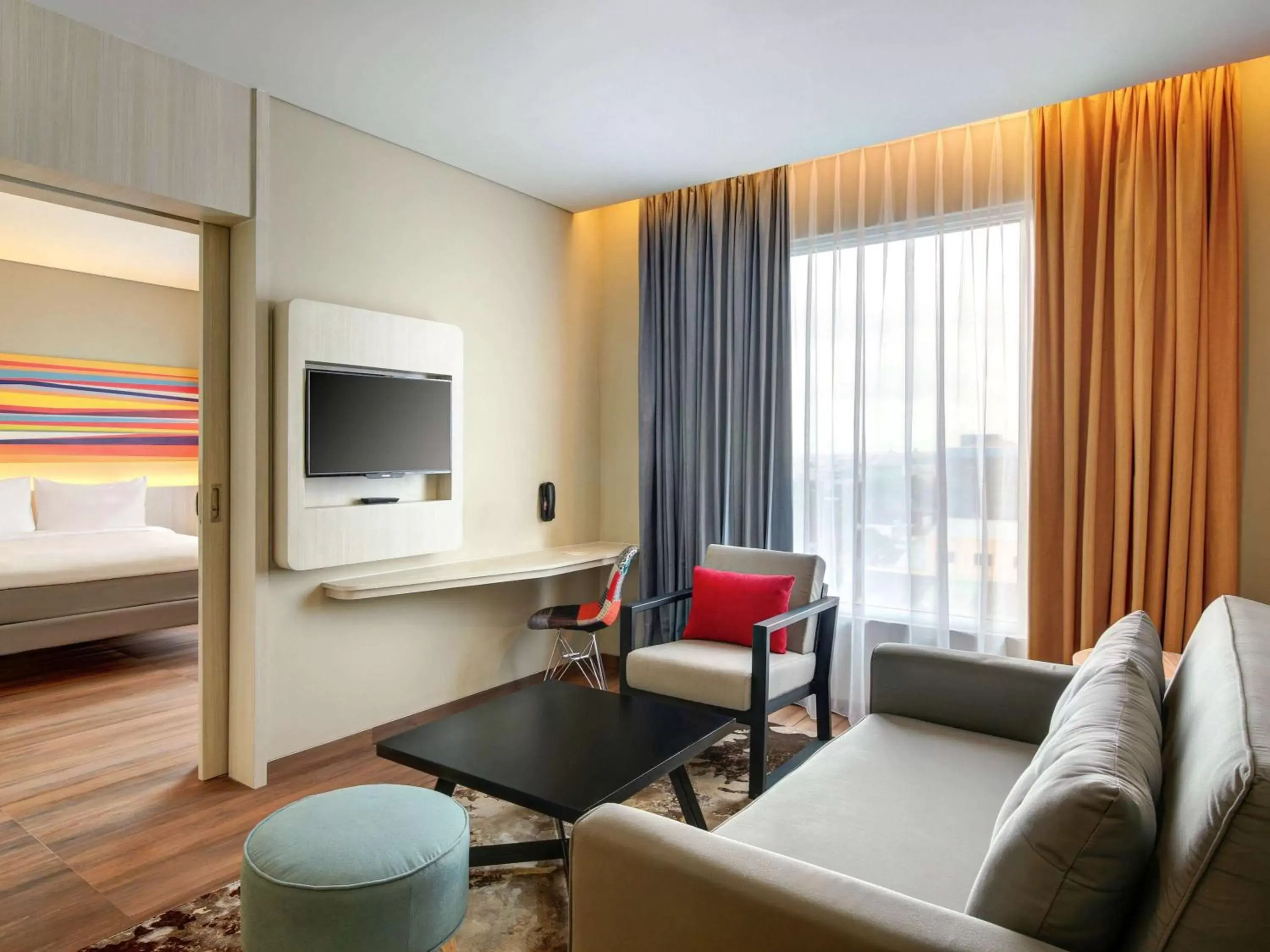 Photo of the whole room, Seating Area in Ibis Styles Makassar Sam Ratulangi