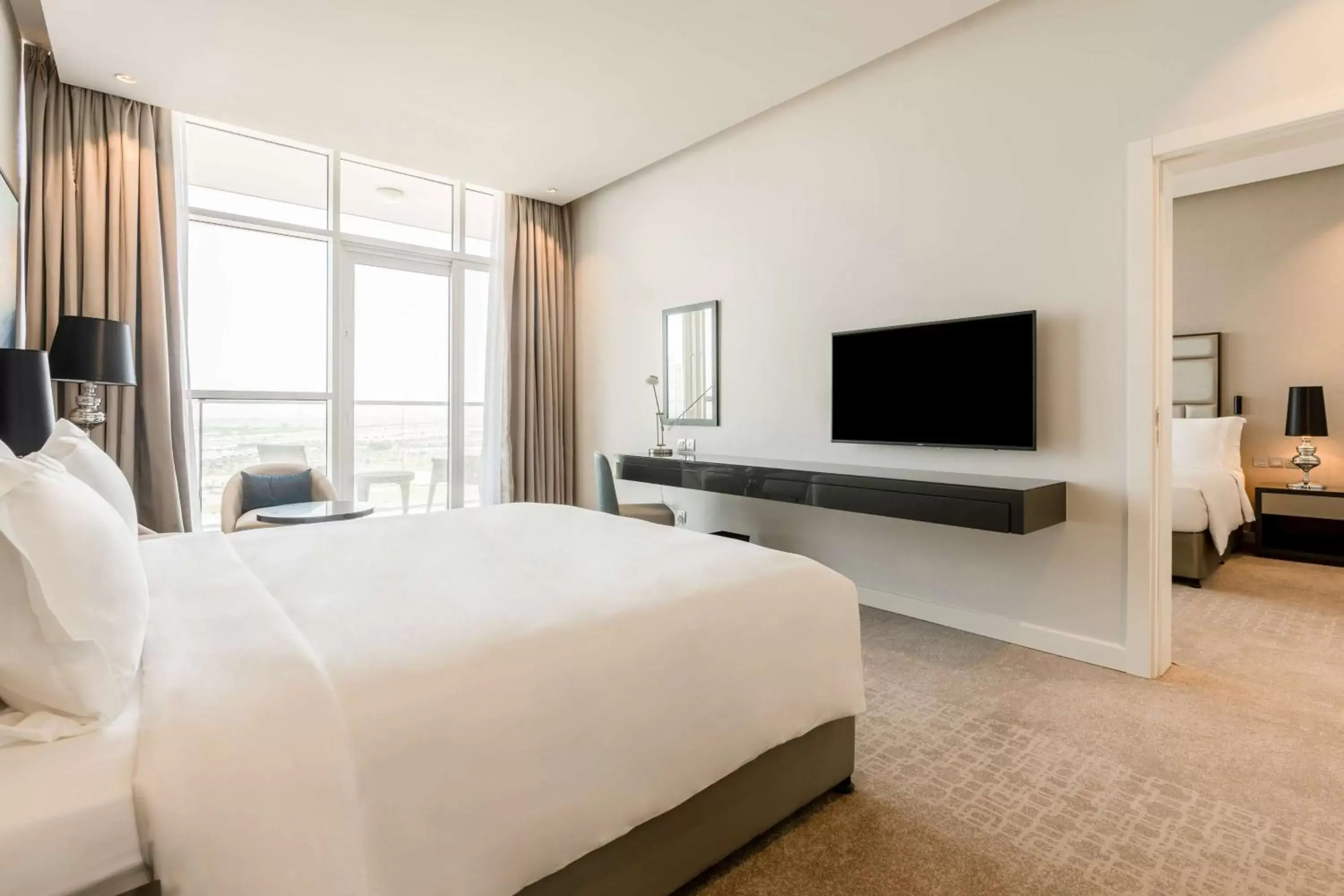 Bedroom, TV/Entertainment Center in Radisson Dubai Damac Hills