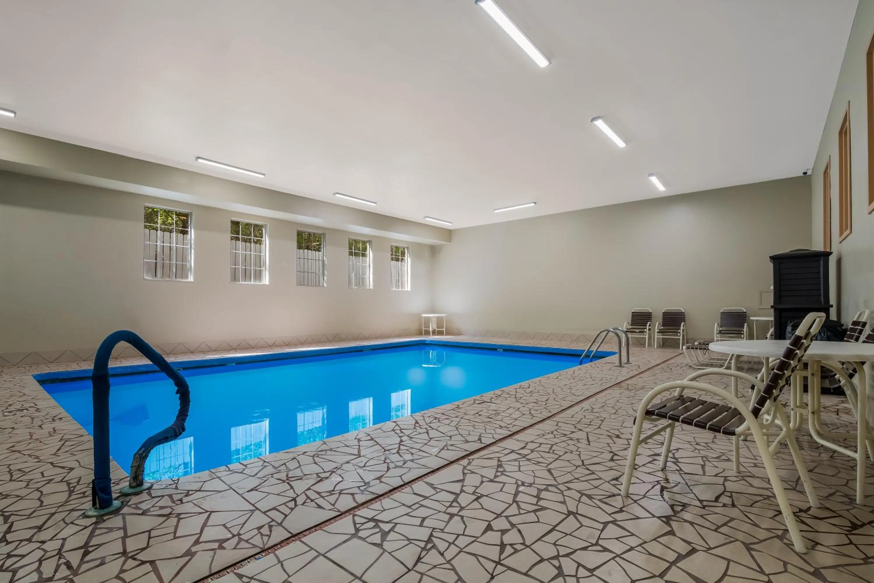 Swimming pool in SureStay Plus Hotel by Best Western Topeka