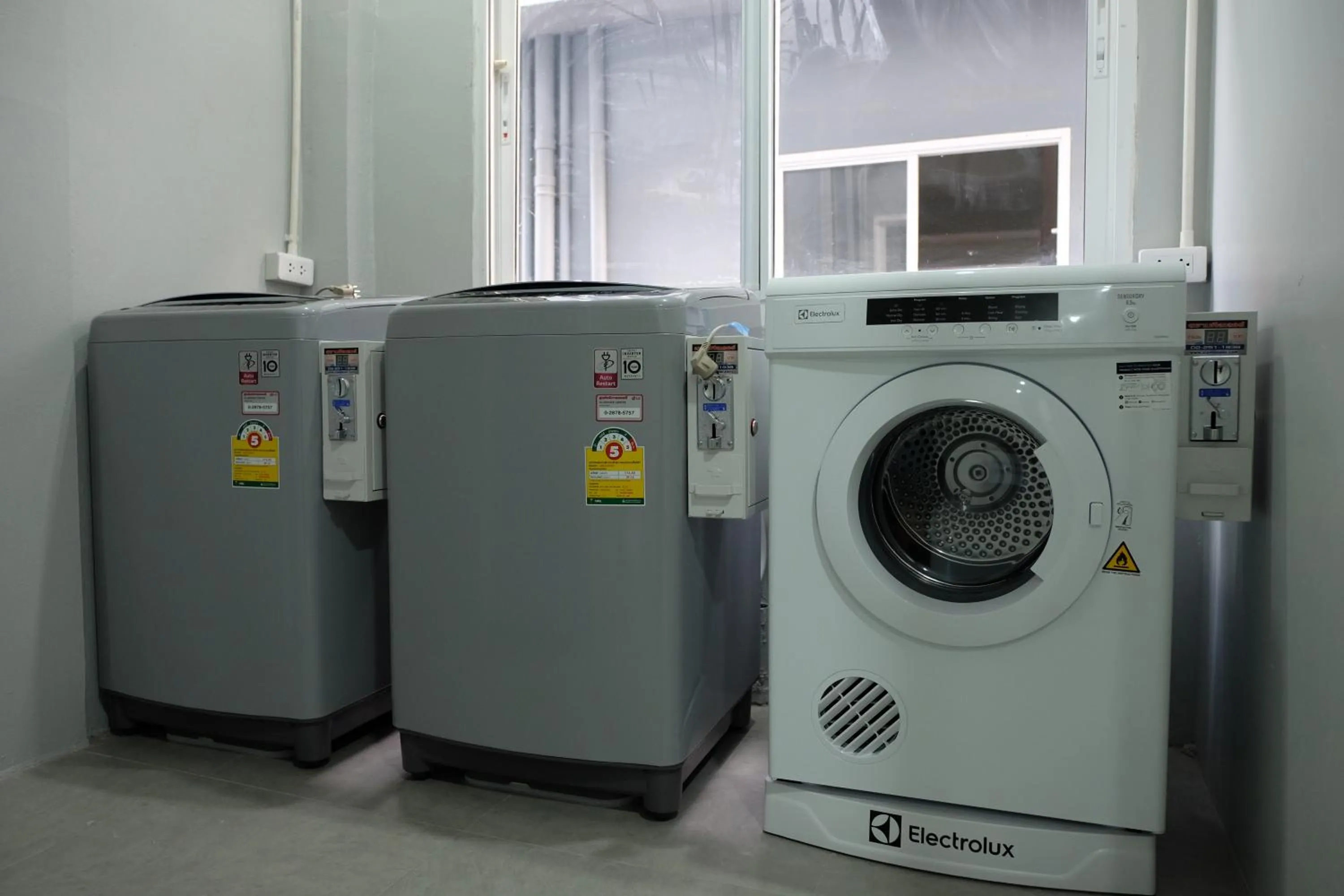 washing machine in Siam Stadium Hostel