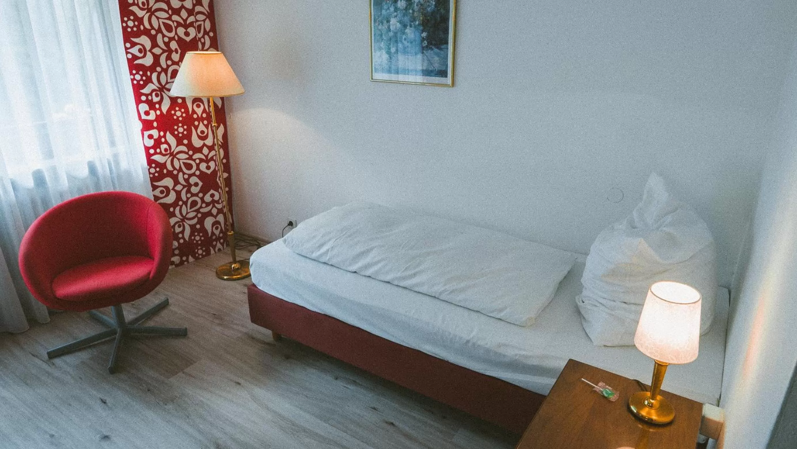 Bed in Hotel Büchner Garni