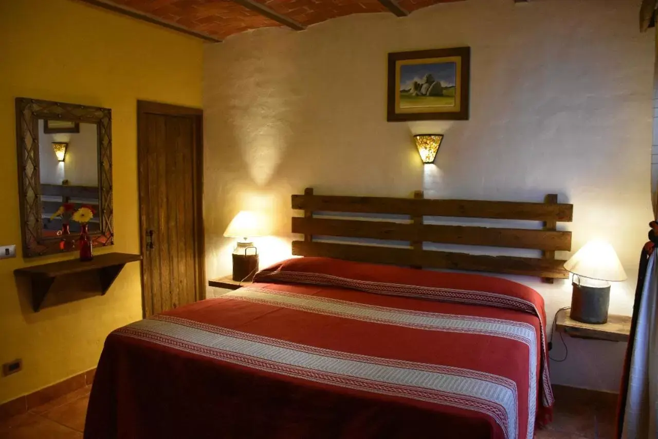 Bed in Hotel Mi Pueblito by Rotamundos