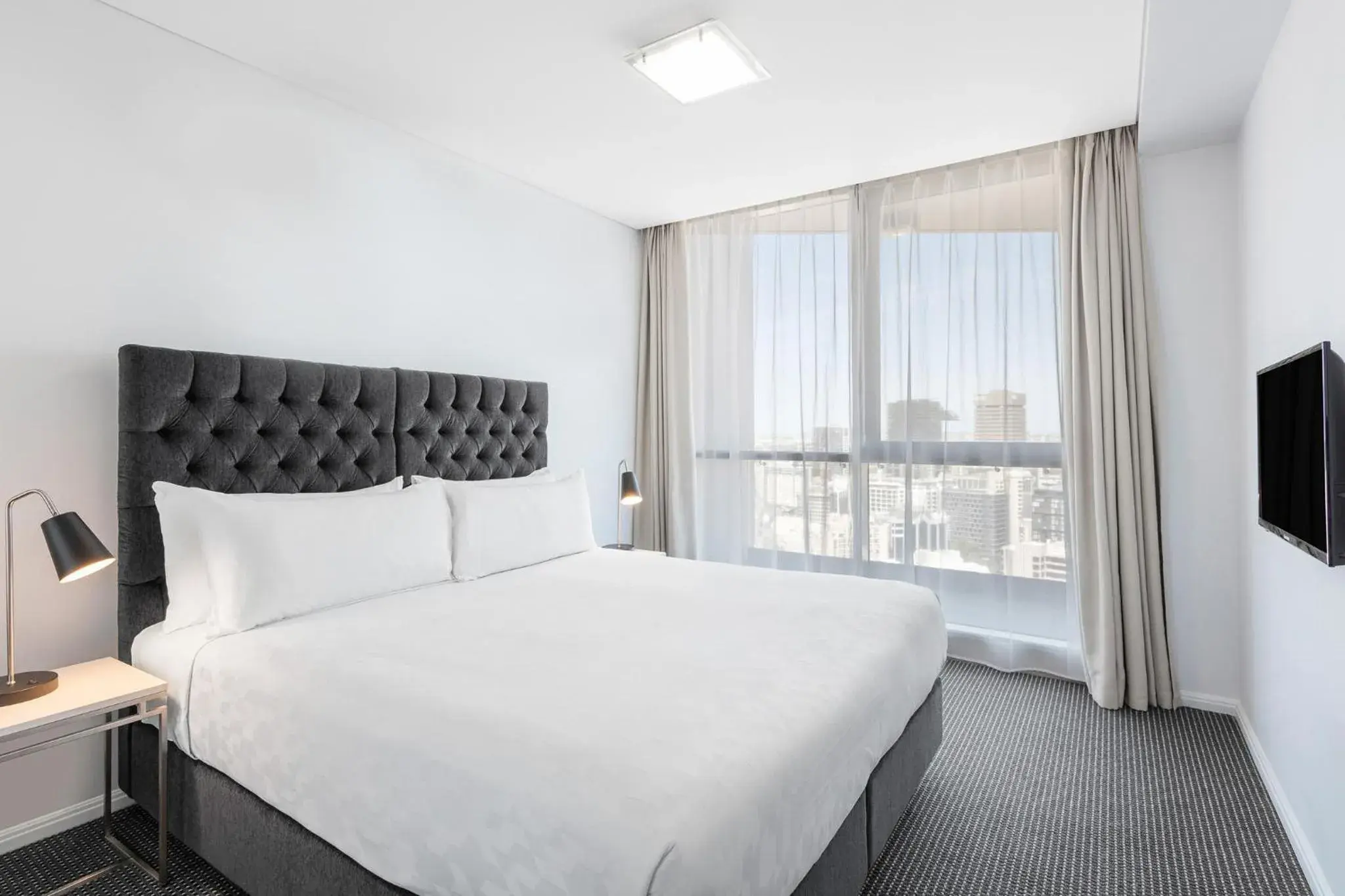 Bed in Meriton Suites Campbell Street, Sydney