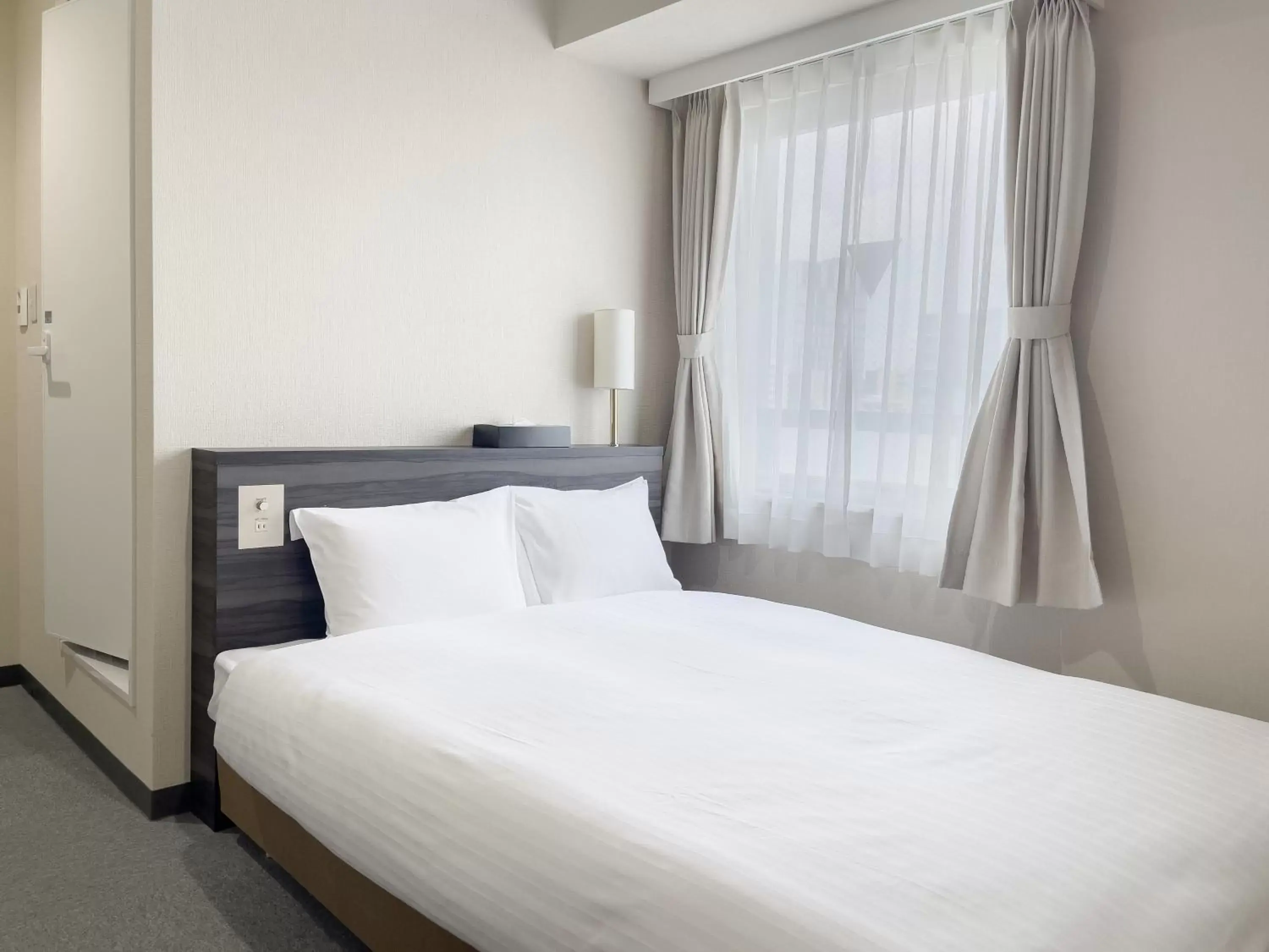 Bed in CHECKinn Osaka Shinimamiya Bed in CHECKinn Osaka Shinimamiya