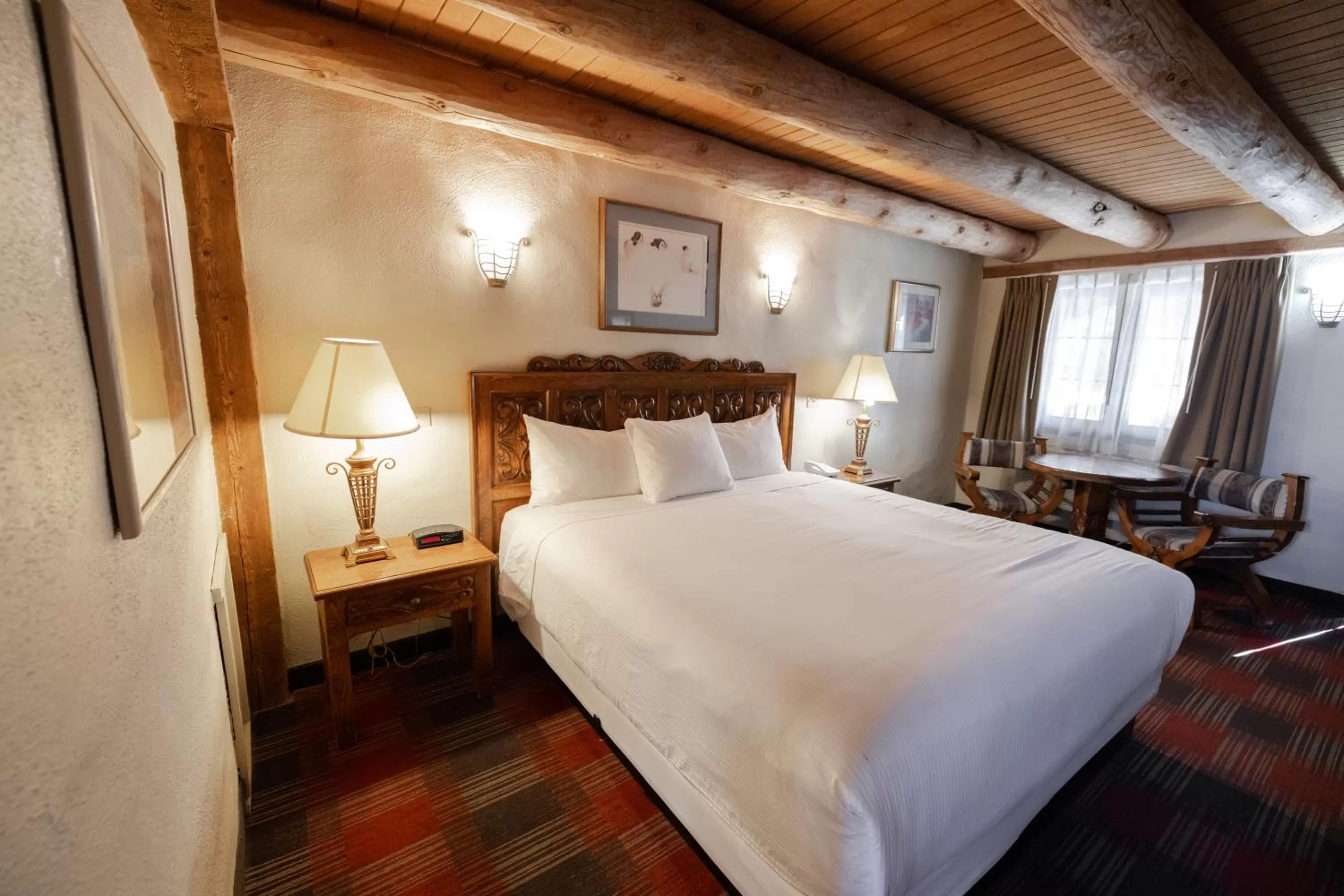 Bed in Sagebrush Inn & Suites