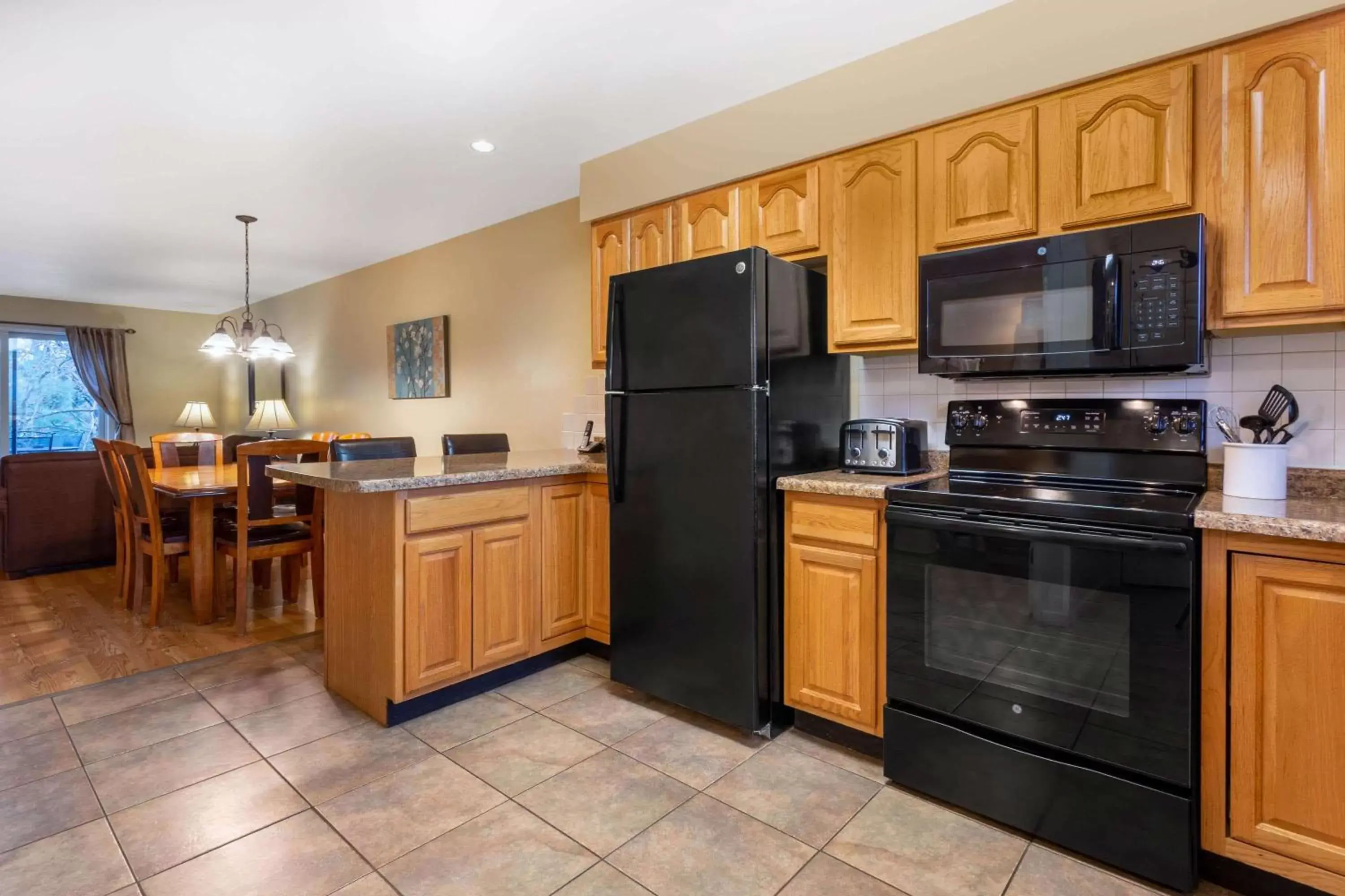 Kitchen or kitchenette, Kitchen/Kitchenette in Tamarack Wisconsin Dells, a Ramada by Wyndham