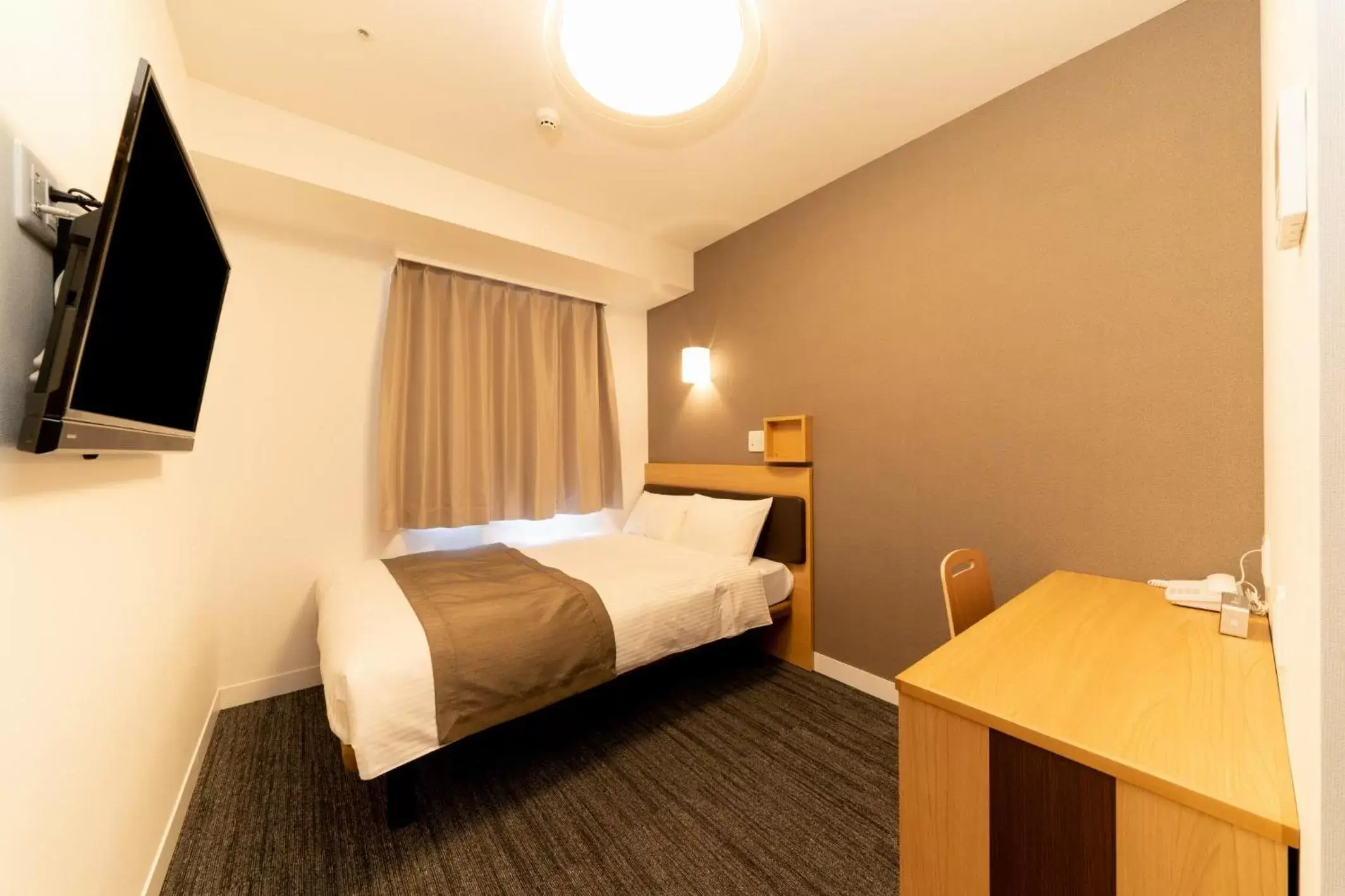 Bed in Pearl Hotel Shinjuku Akebonobashi Bed in Pearl Hotel Shinjuku Akebonobashi