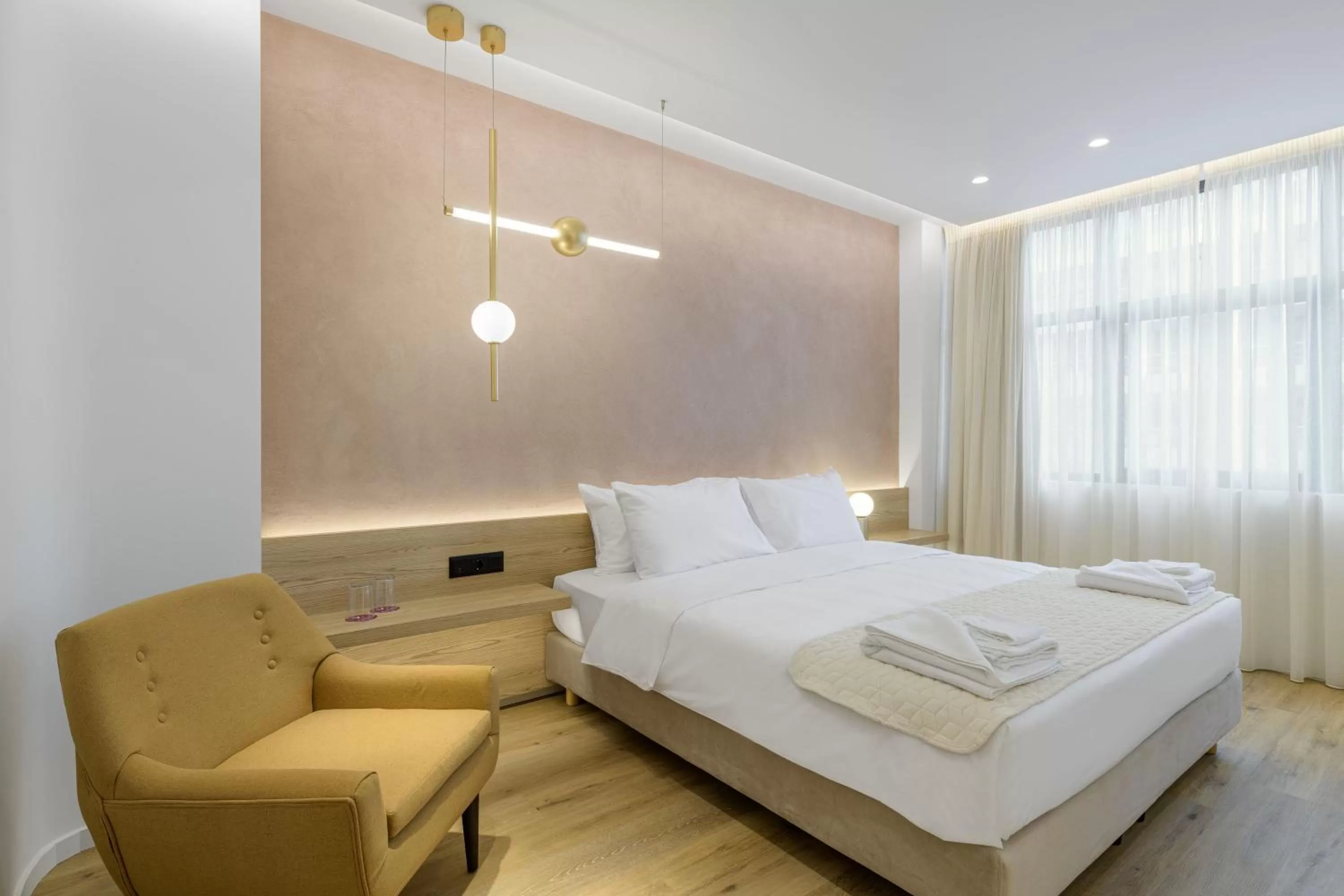 Bed in Acropolis Magenta Luxury Suites