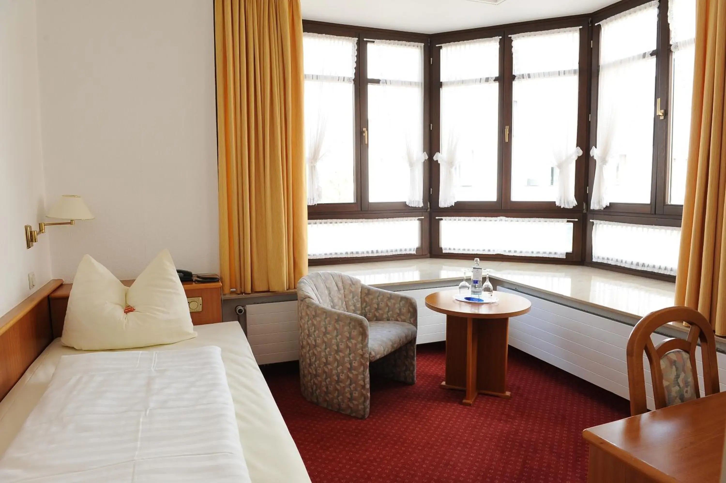 Bedroom, Seating Area in Arkaden Hotel