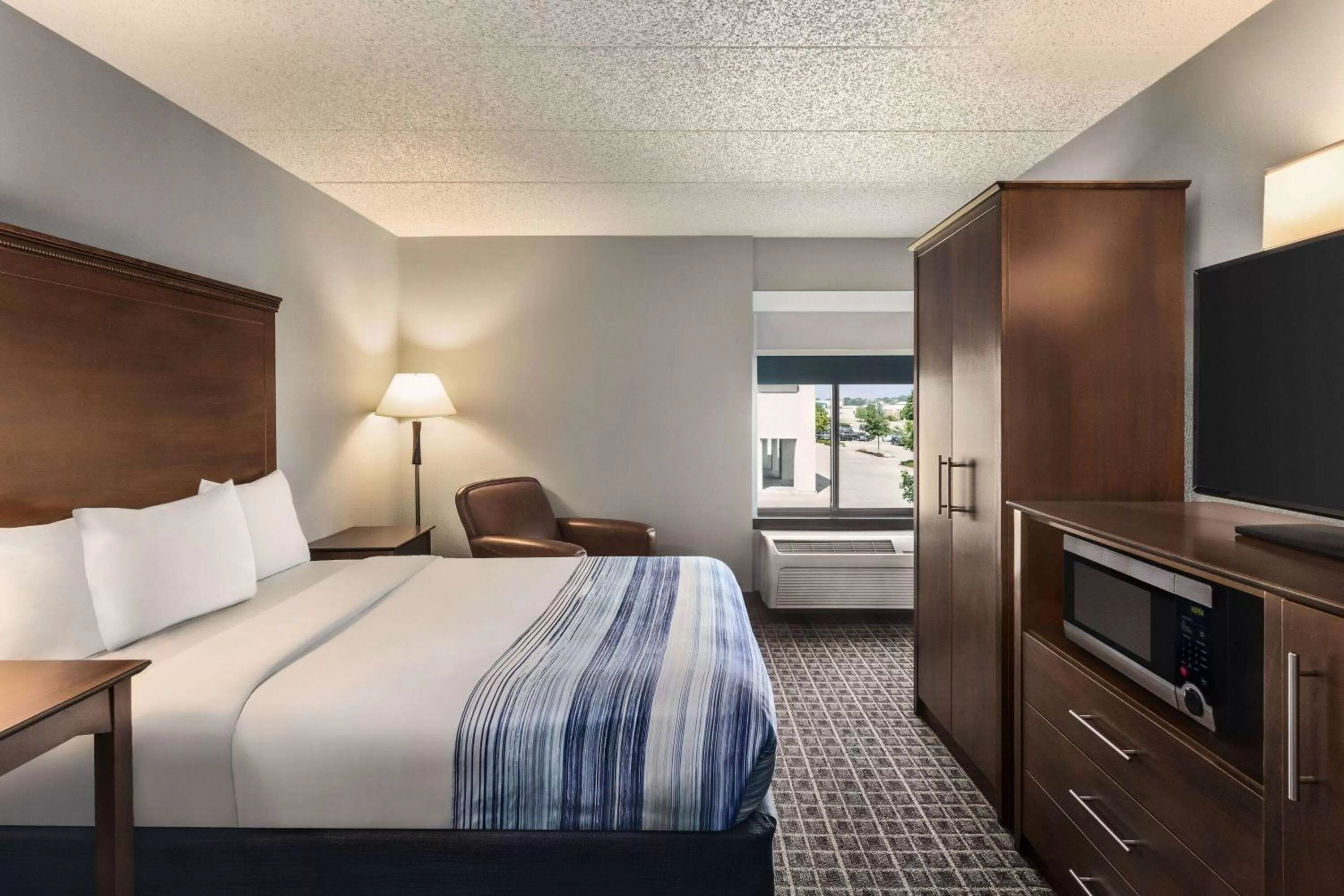 Photo of the whole room, Bed in AmericInn by Wyndham Madison West