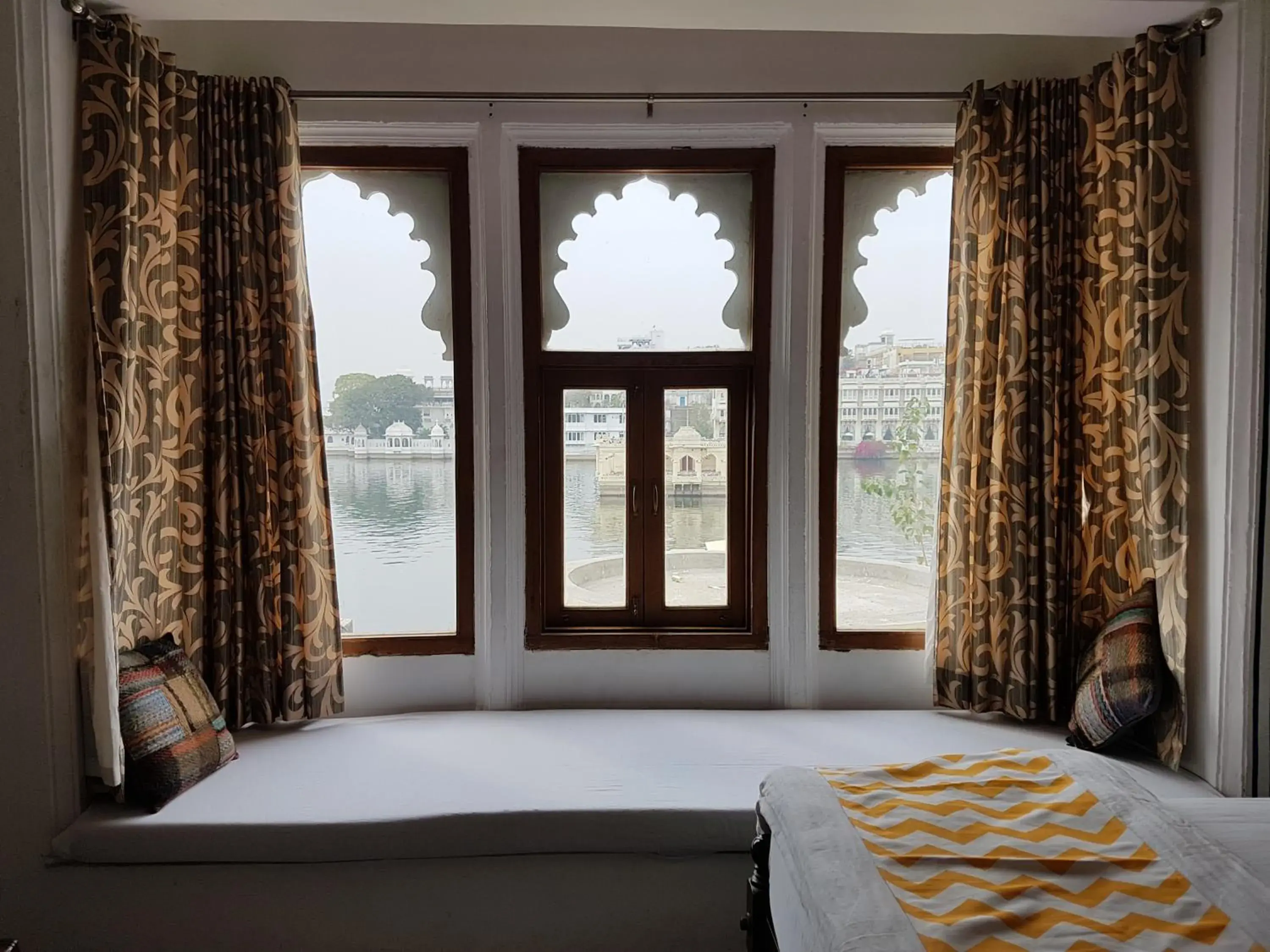 Photo of the whole room, Bed in Hotel Devraj Niwas on Lake Pichola Udaipur