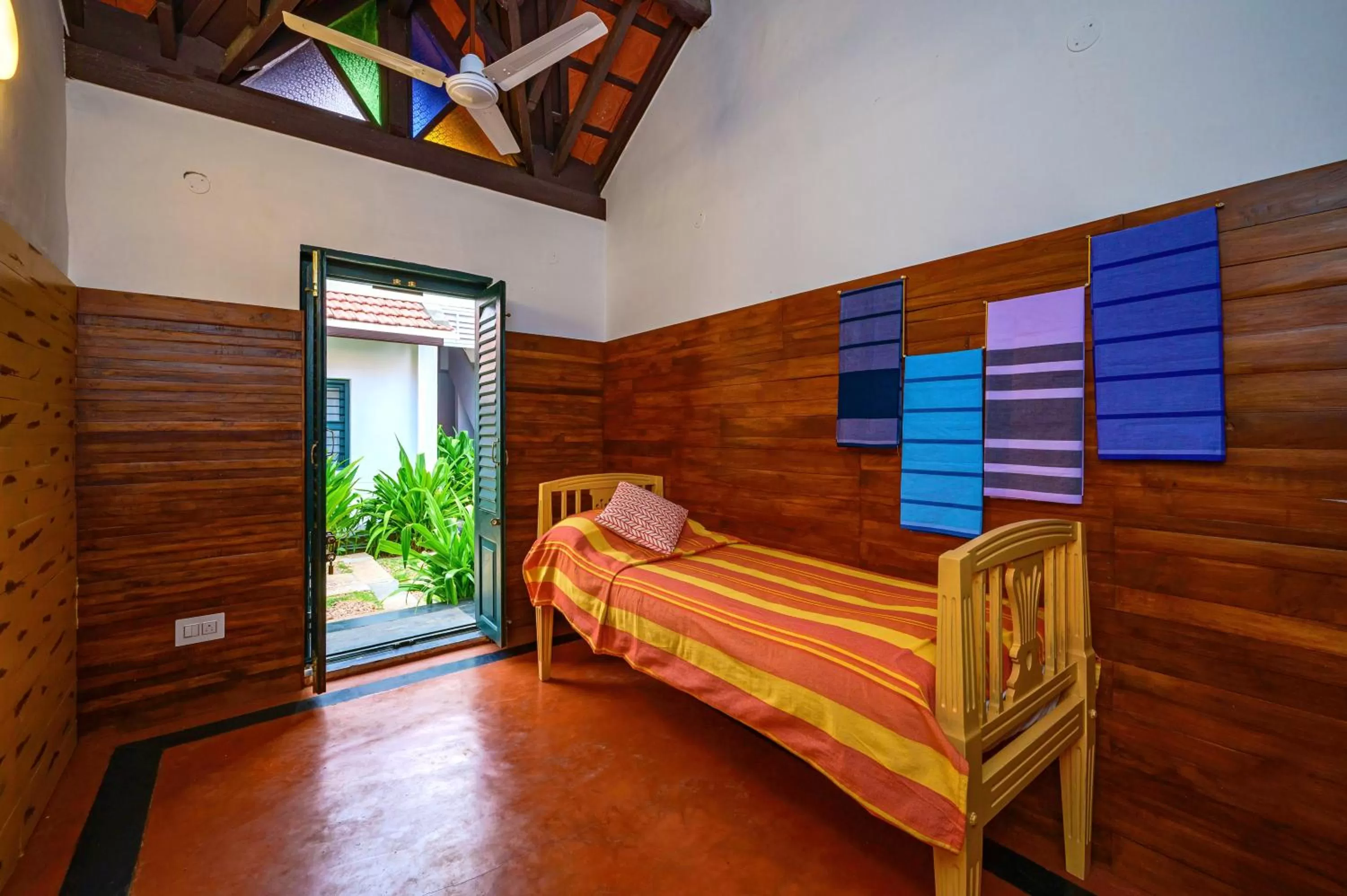 Bed in Neemrana's Coconut Alley