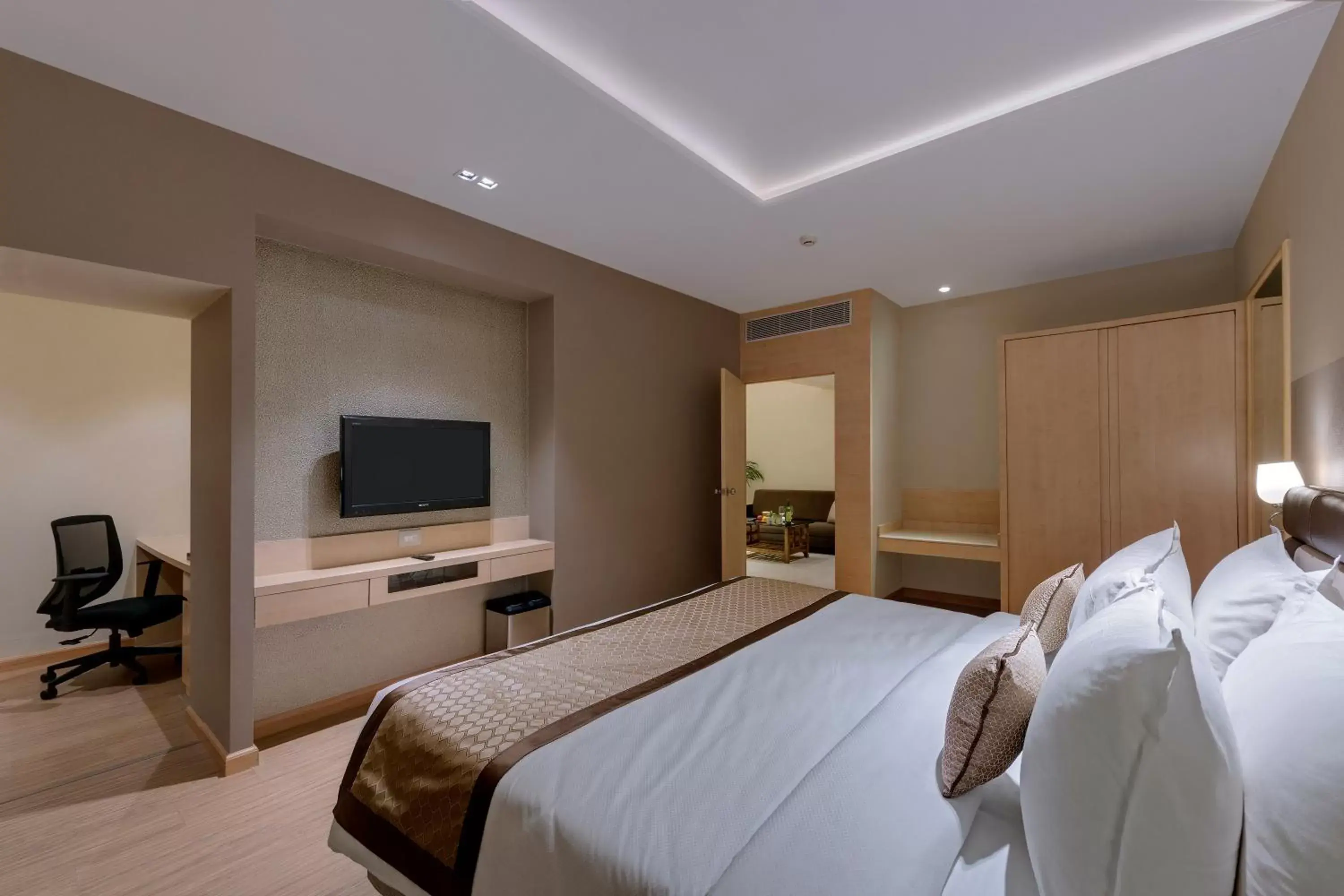 Bedroom, TV/Entertainment Center in The Fern Residency Aurangabad