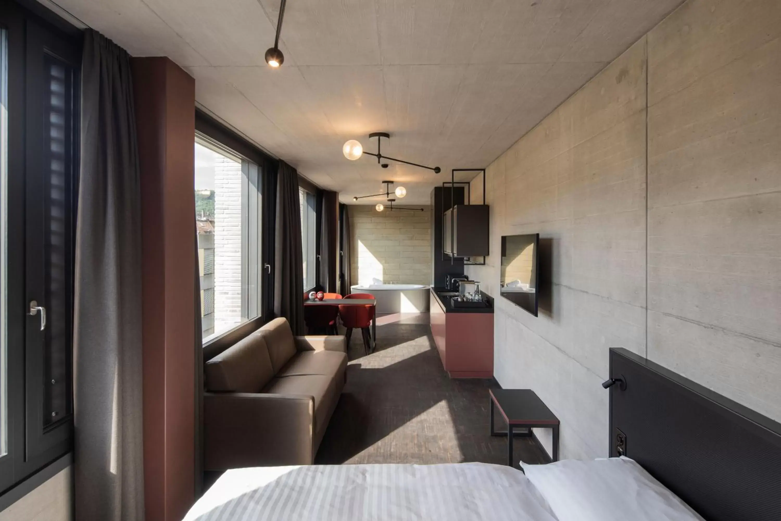 Bedroom, Seating Area in Tailormade Hotel LEO St Gallen