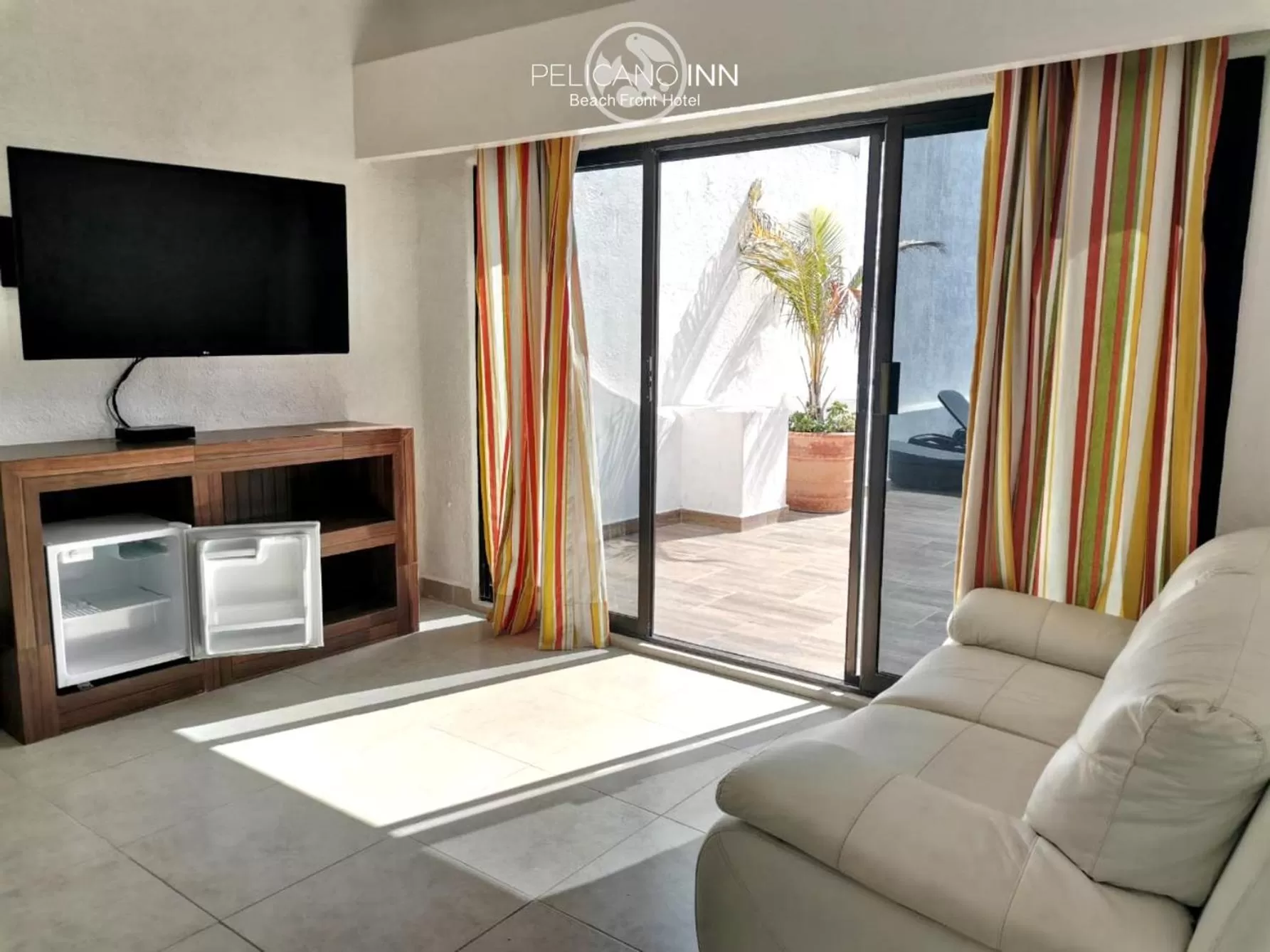 TV and multimedia in Pelicano Inn Playa del Carmen - Beachfront Hotel