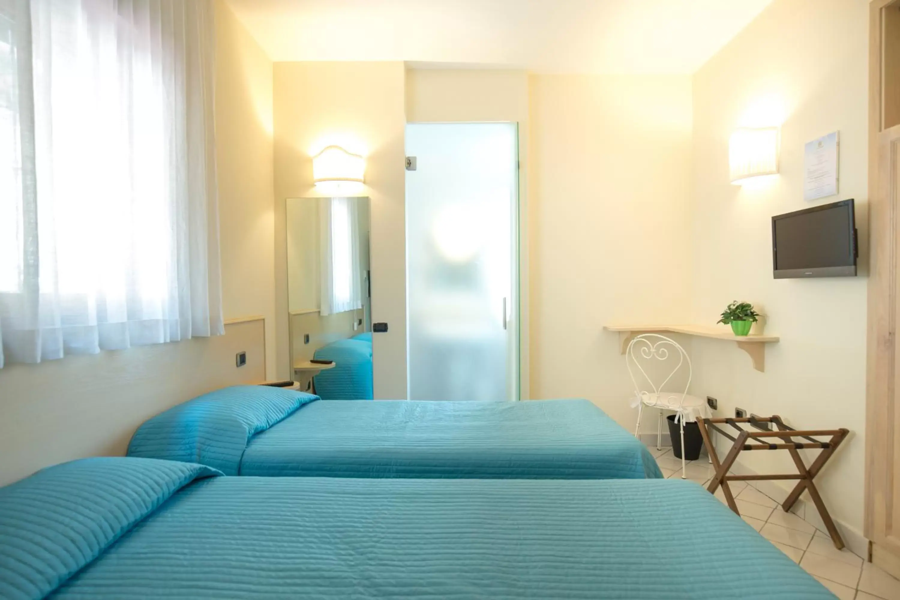 Bed in Hotel Villa Poseidon & Events