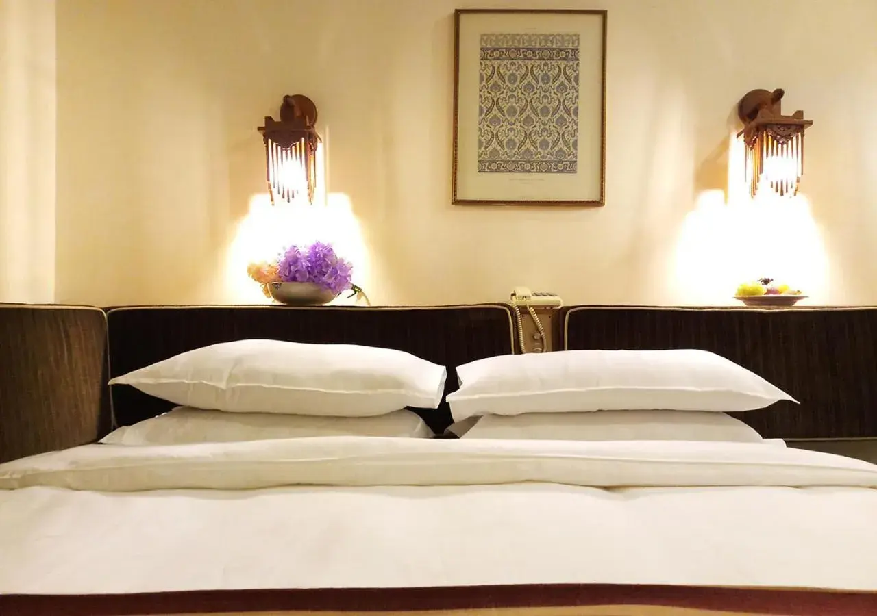 Decorative detail, Bed in Oriental Palace Hotel