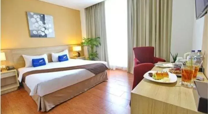Bed in Padjadjaran Suites Resort and Convention Hotel