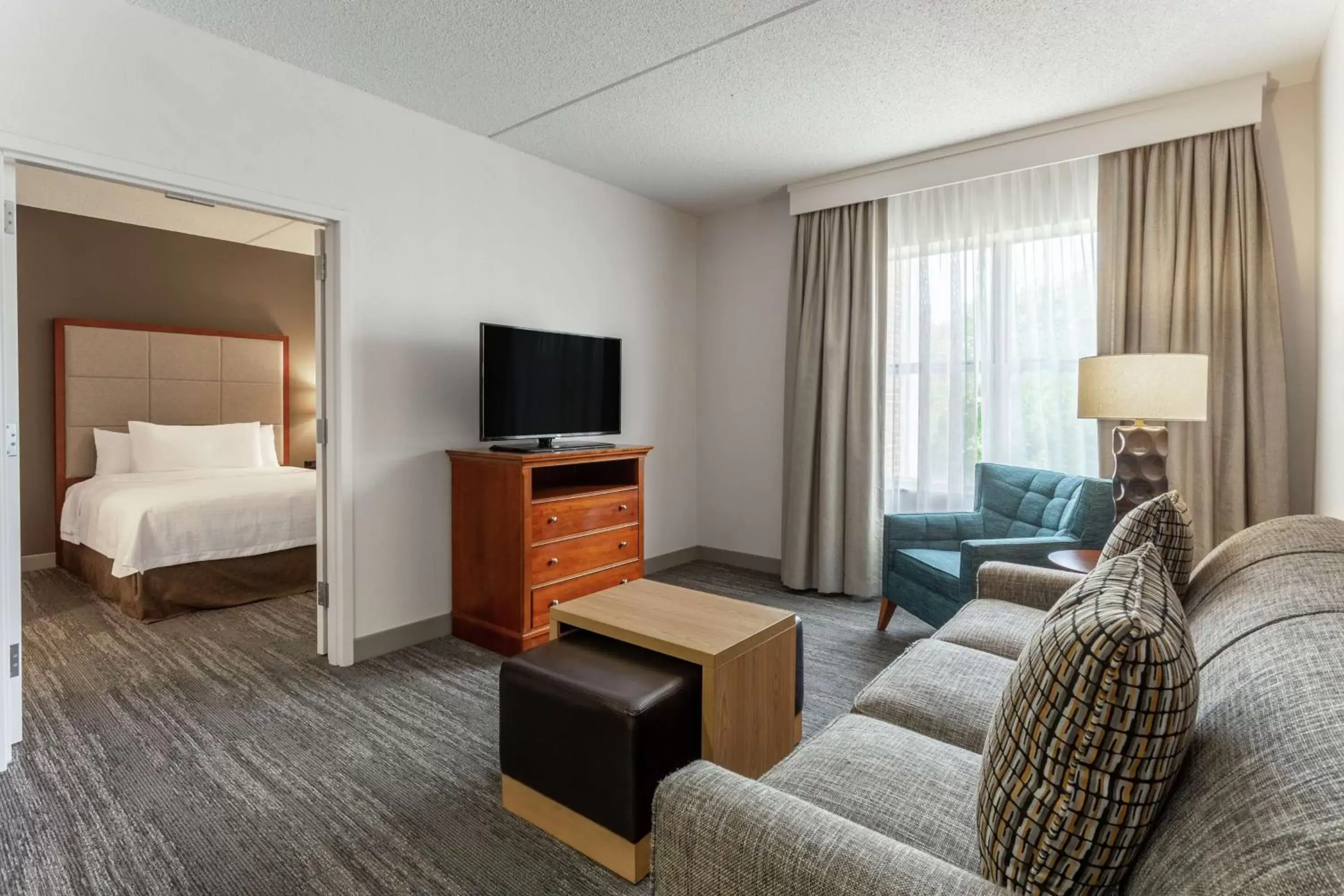 Living room, TV/Entertainment Center in Homewood Suites by Hilton Albany