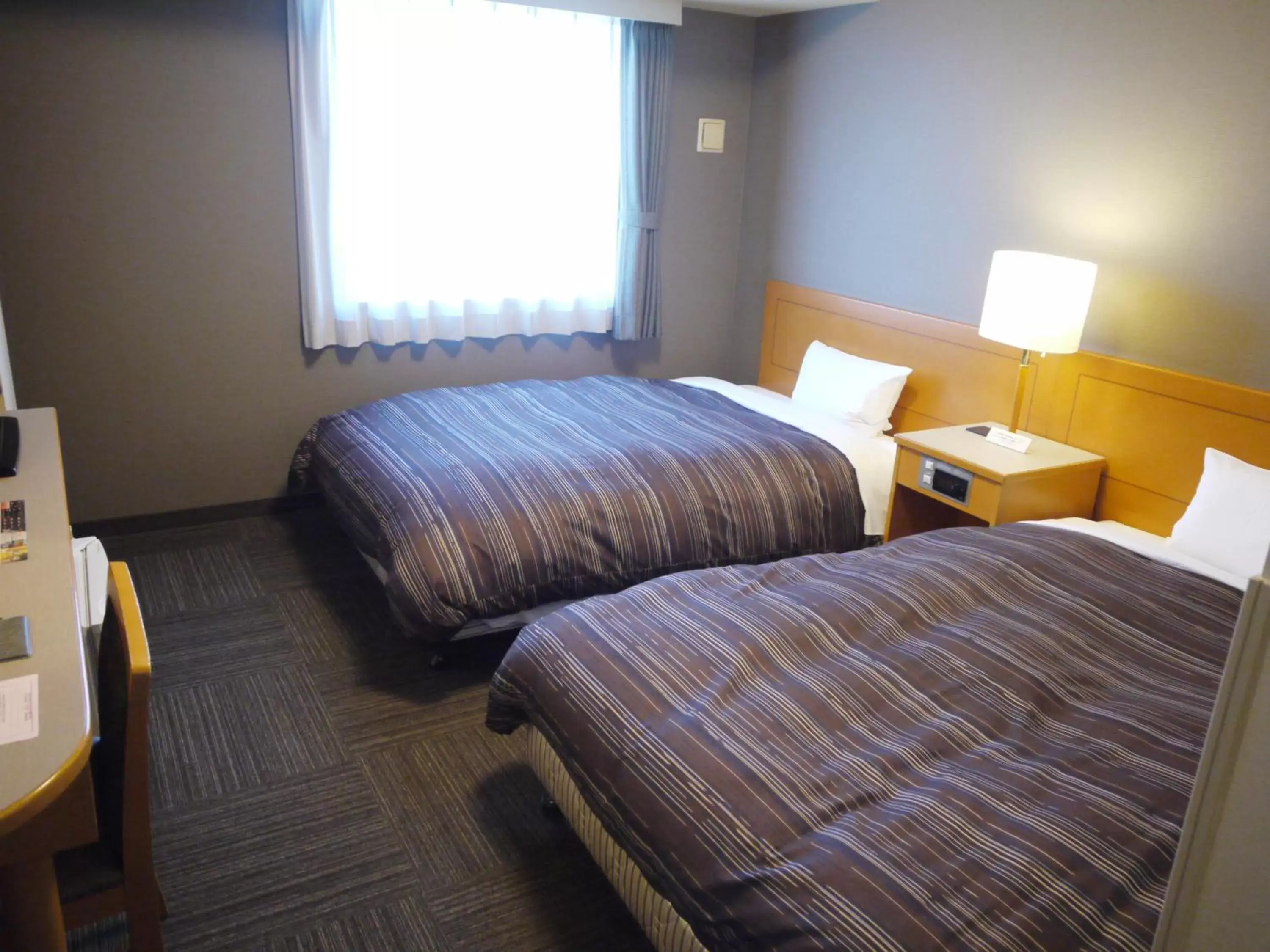 Bed in Hotel Route-Inn Niigata Kencho-minami