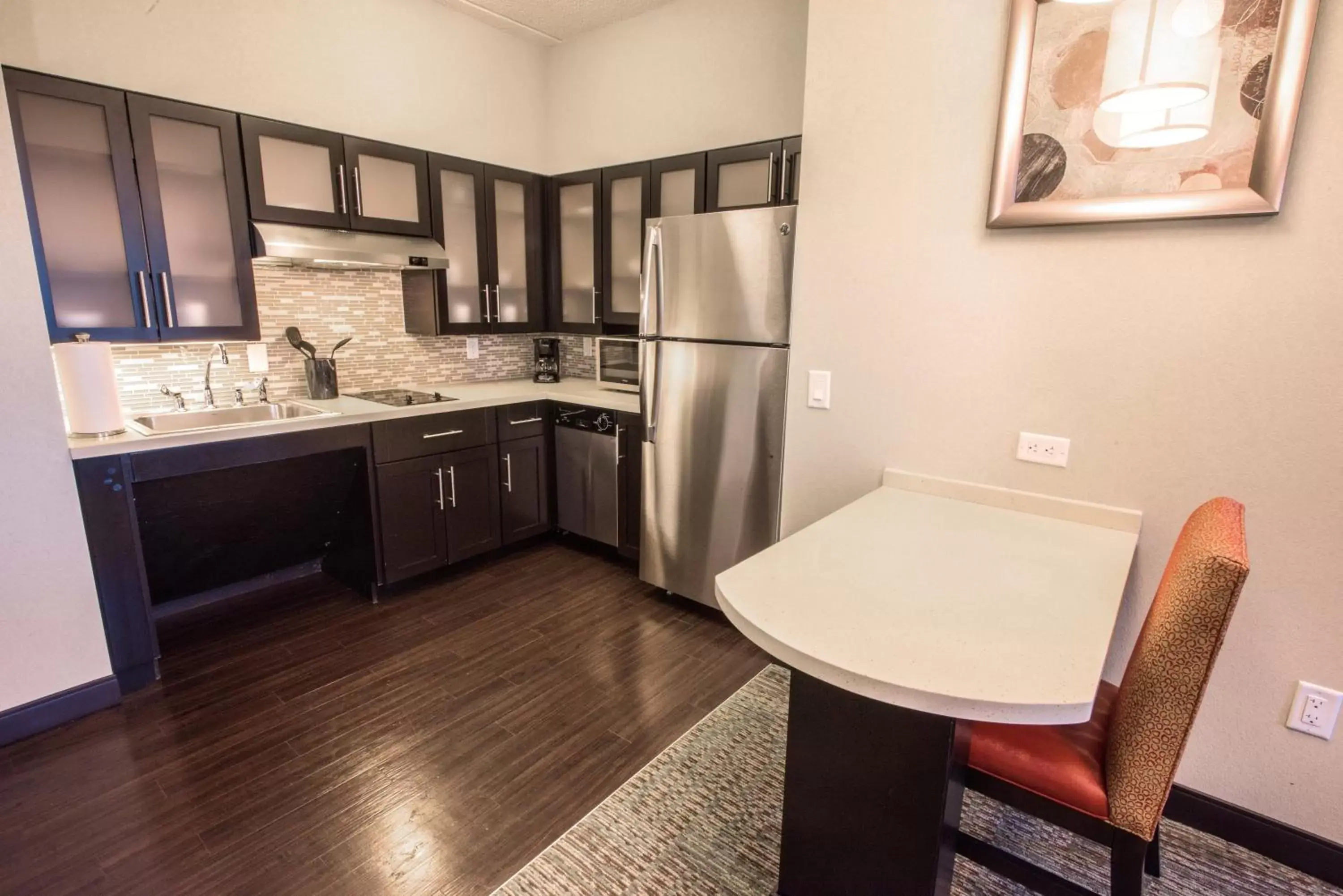 Photo of the whole room, Kitchen/Kitchenette in Staybridge Suites Albany Wolf Rd-Colonie Center, an IHG Hotel