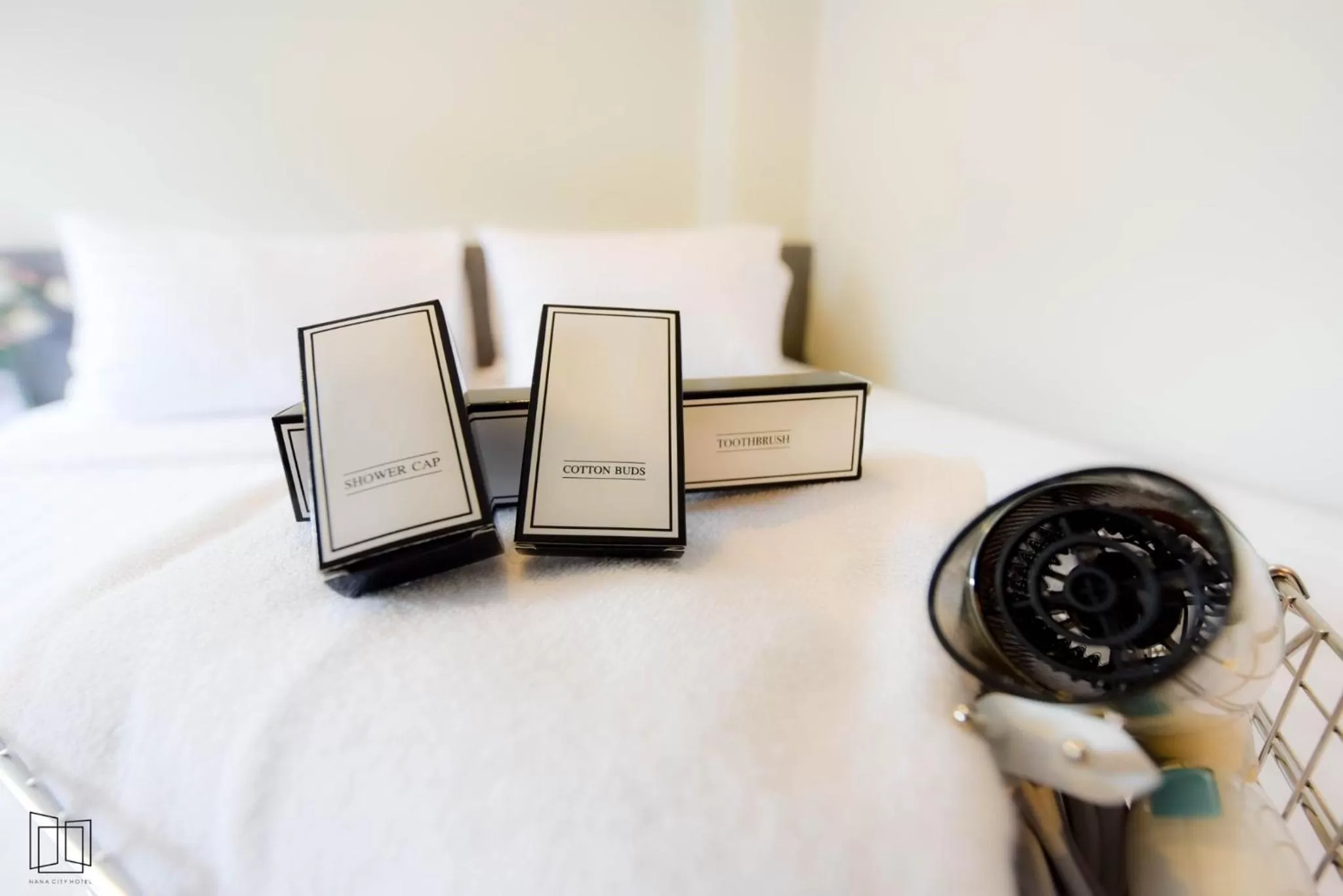 Bed in Nana City Hotel