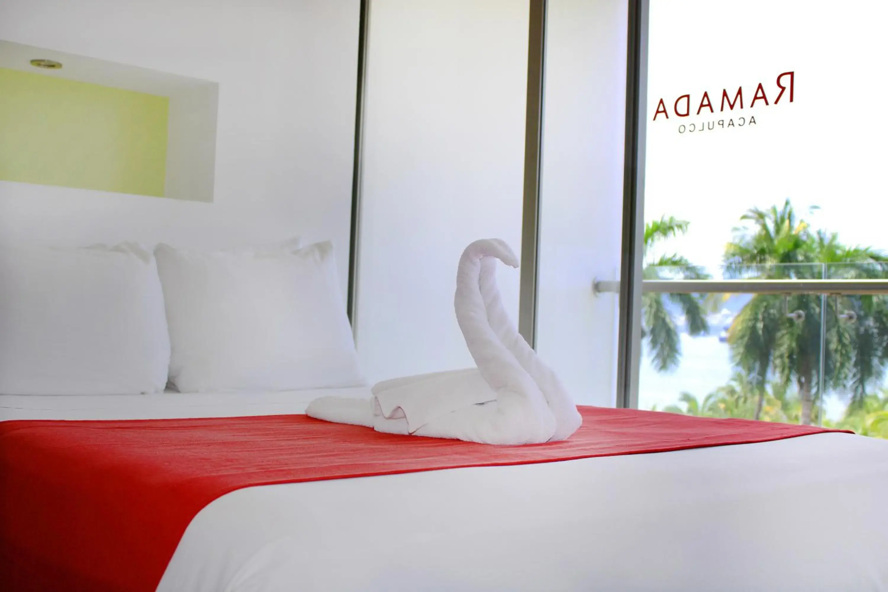 Bed in Ramada by Wyndham Acapulco Hotel & Suites