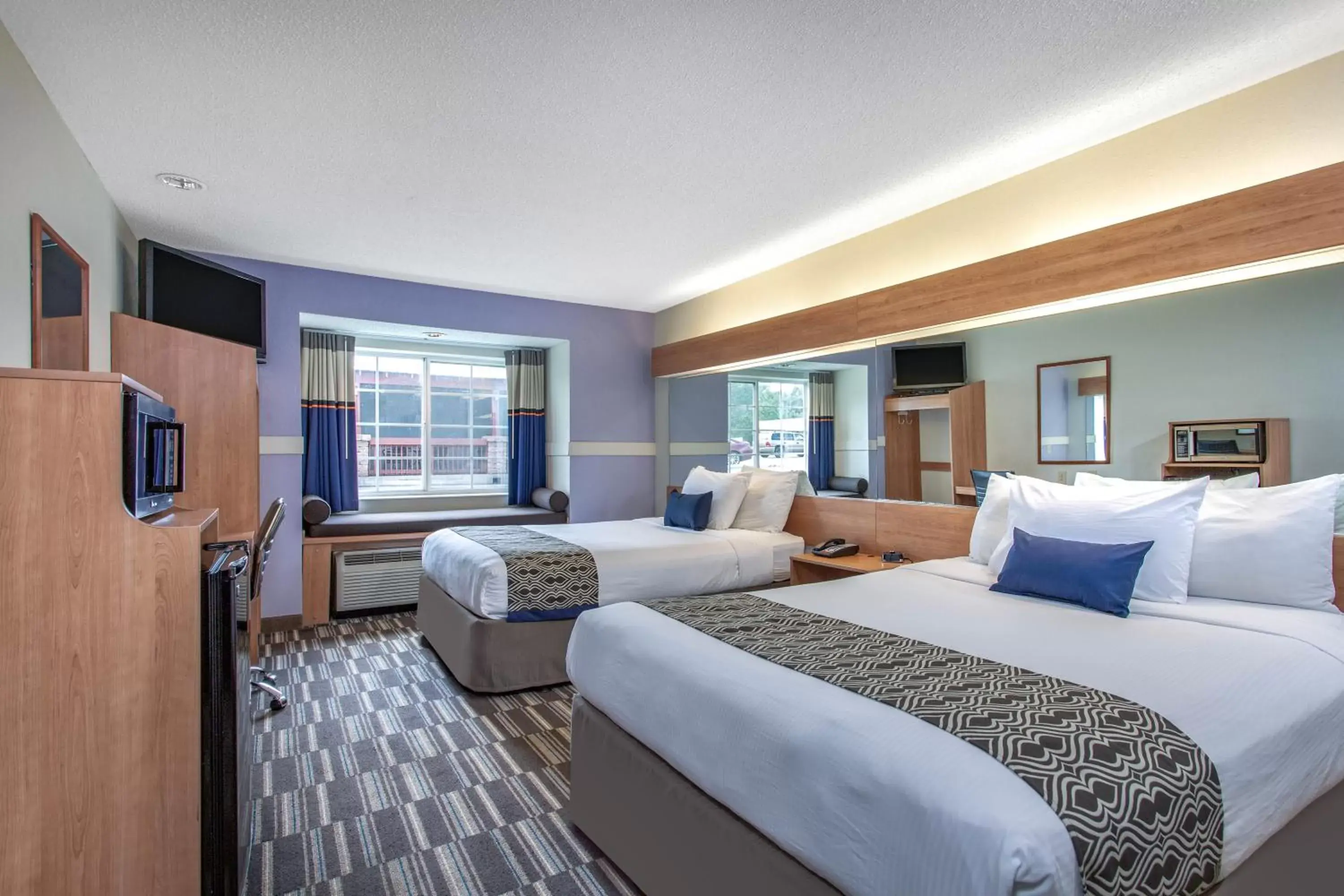 Bed in Microtel Inn & Suites by Wyndham Lillington/Campbell University Bed in Microtel Inn & Suites by Wyndham Lillington/Campbell University