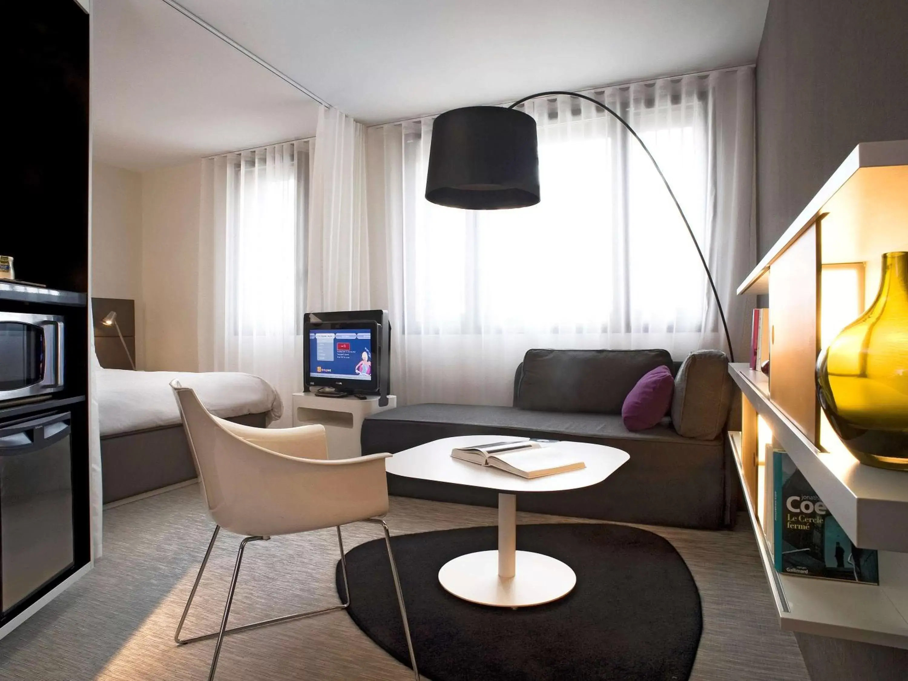 Photo of the whole room, TV/Entertainment Center in Novotel Suites Perpignan Centre