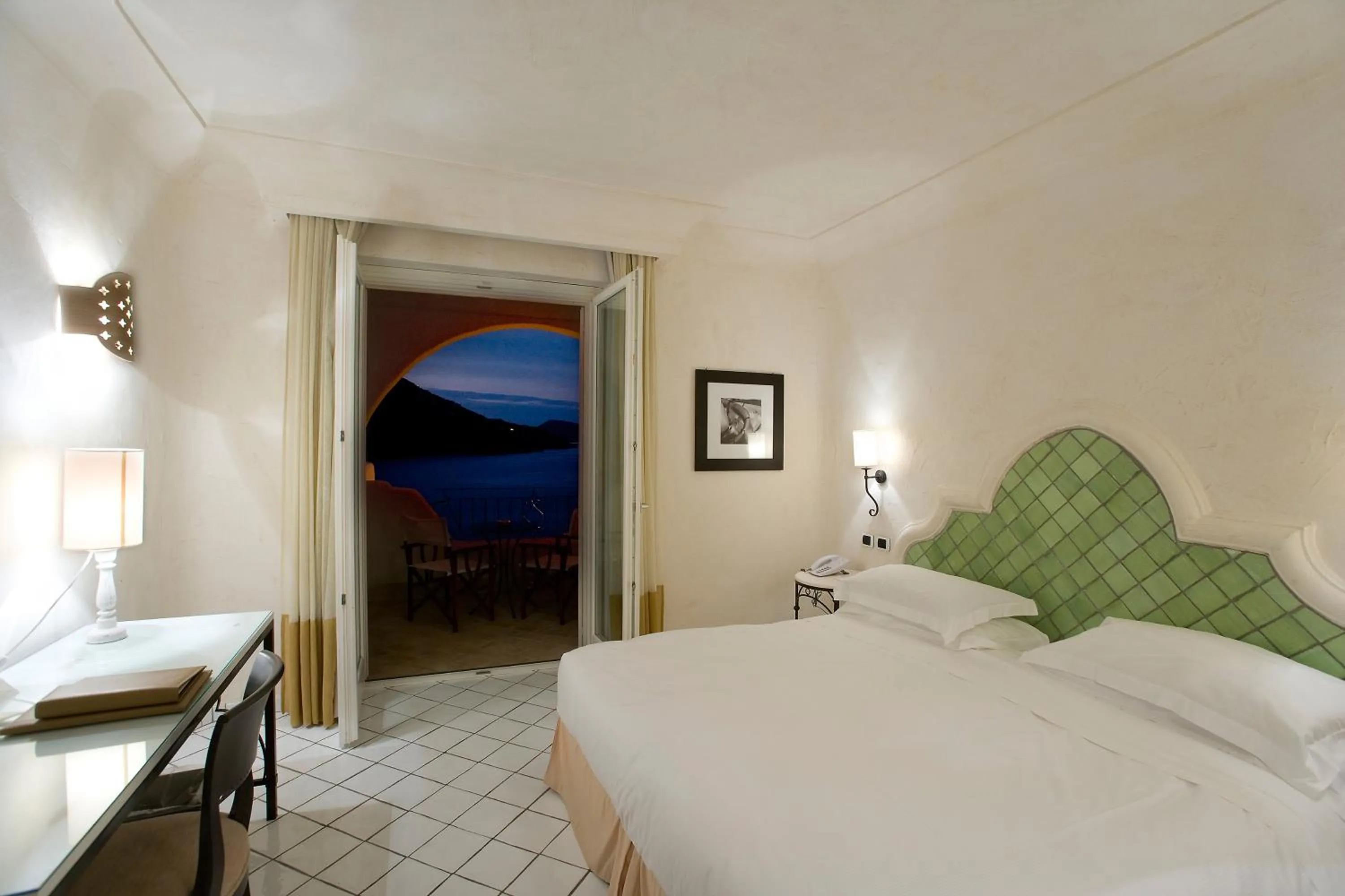 Balcony/Terrace, Bed in Therasia Resort Sea and SPA - The Leading Hotels of the World