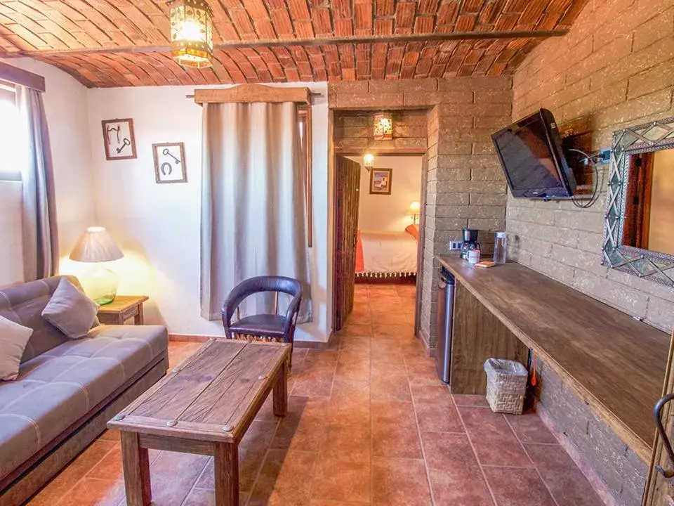 Photo of the whole room, Seating Area in Hotel Mi Pueblito by Rotamundos