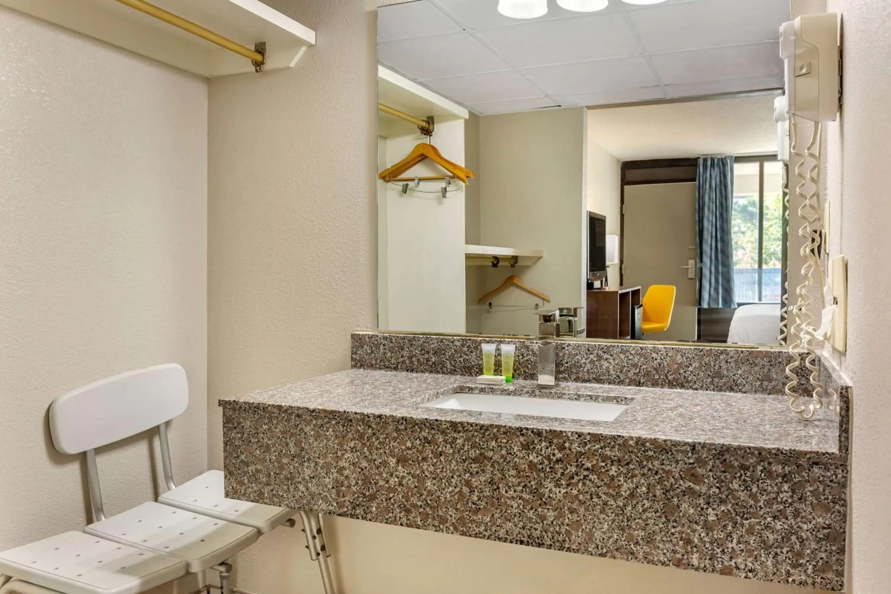 TV and multimedia, Bathroom in Days Inn & Suites by Wyndham Rocky Mount Golden East