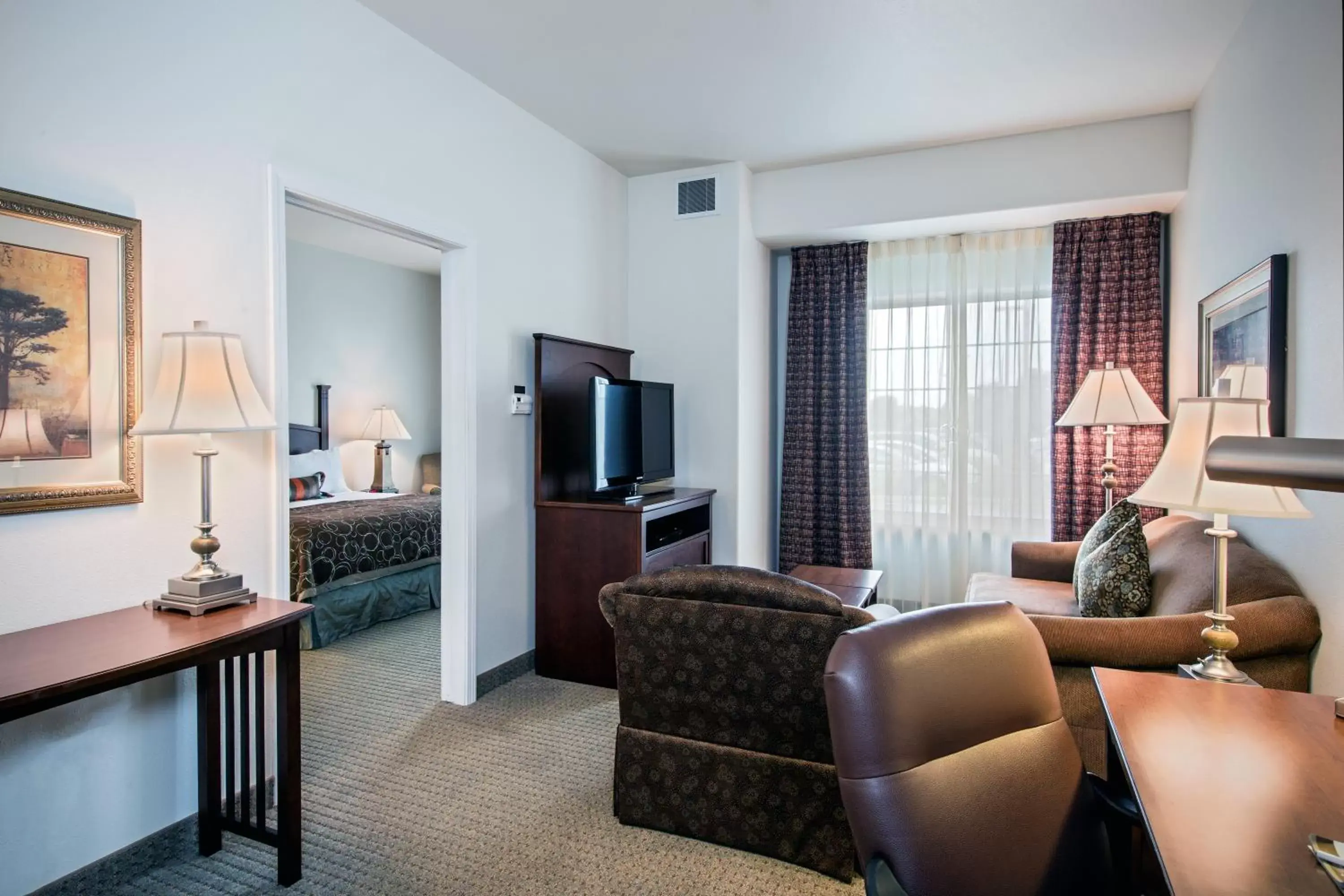 Photo of the whole room, Seating Area in Staybridge Suites Rockford, an IHG Hotel