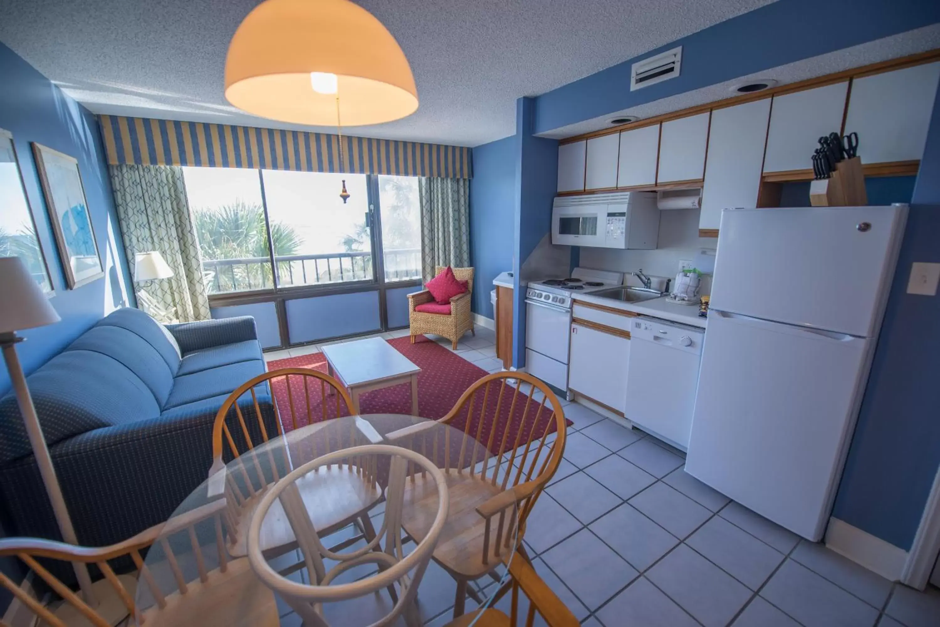 Kitchen or kitchenette, Dining Area in Ocean Club Resort Myrtle Beach a Ramada by Wyndham