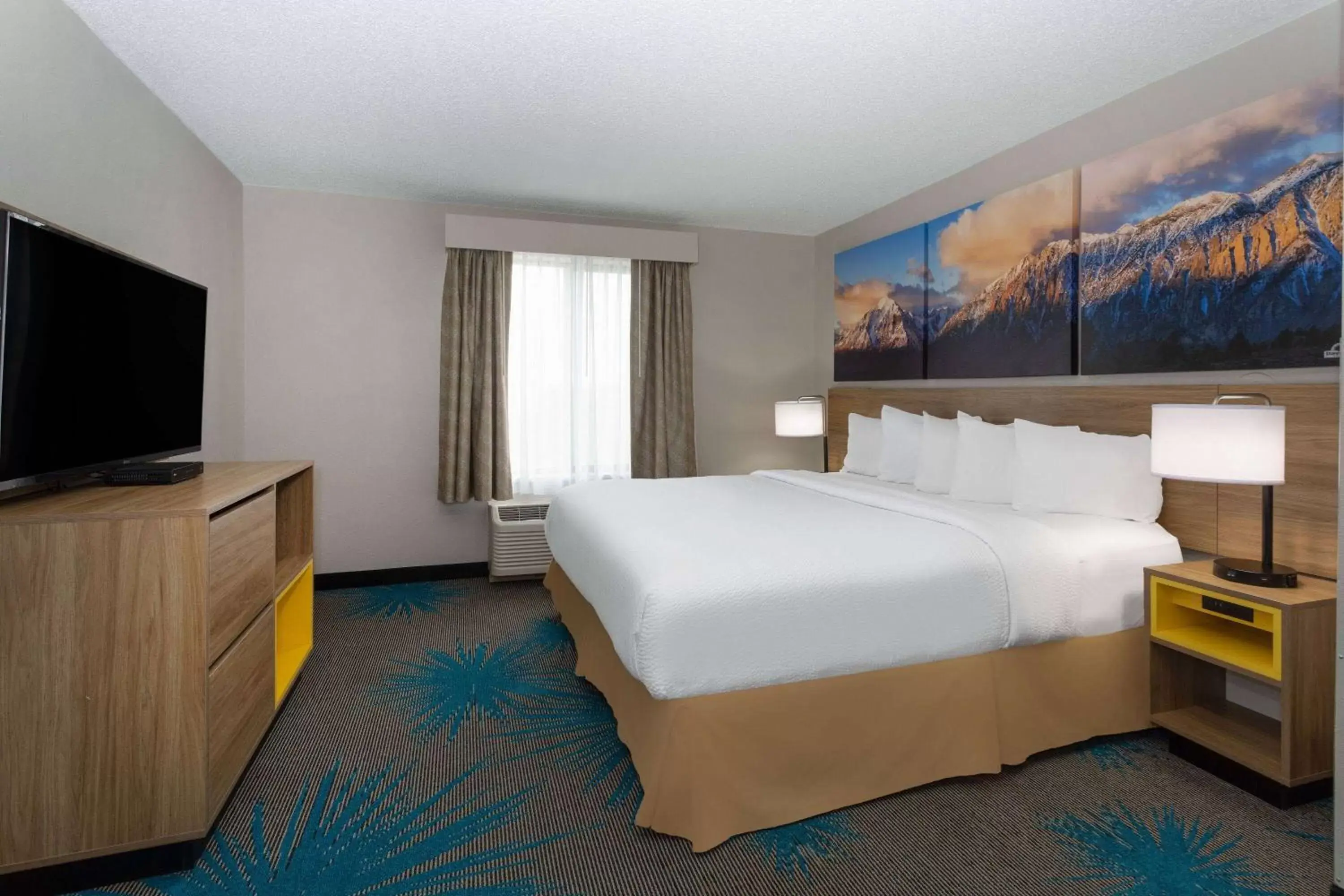 Bed in Days Inn & Suites by Wyndham Denver International Airport