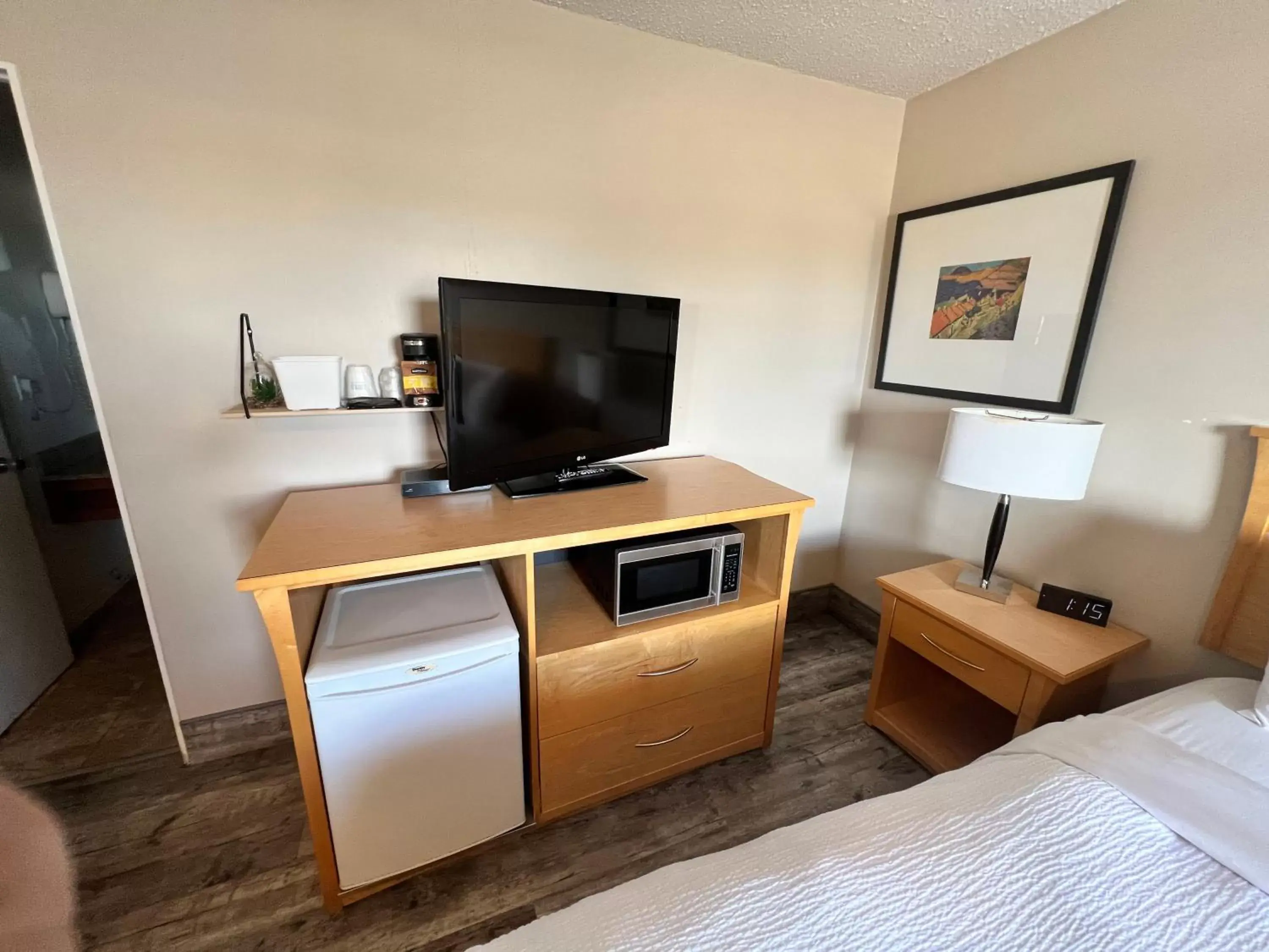 Bedroom, TV/Entertainment Center in Thriftlodge Saskatoon