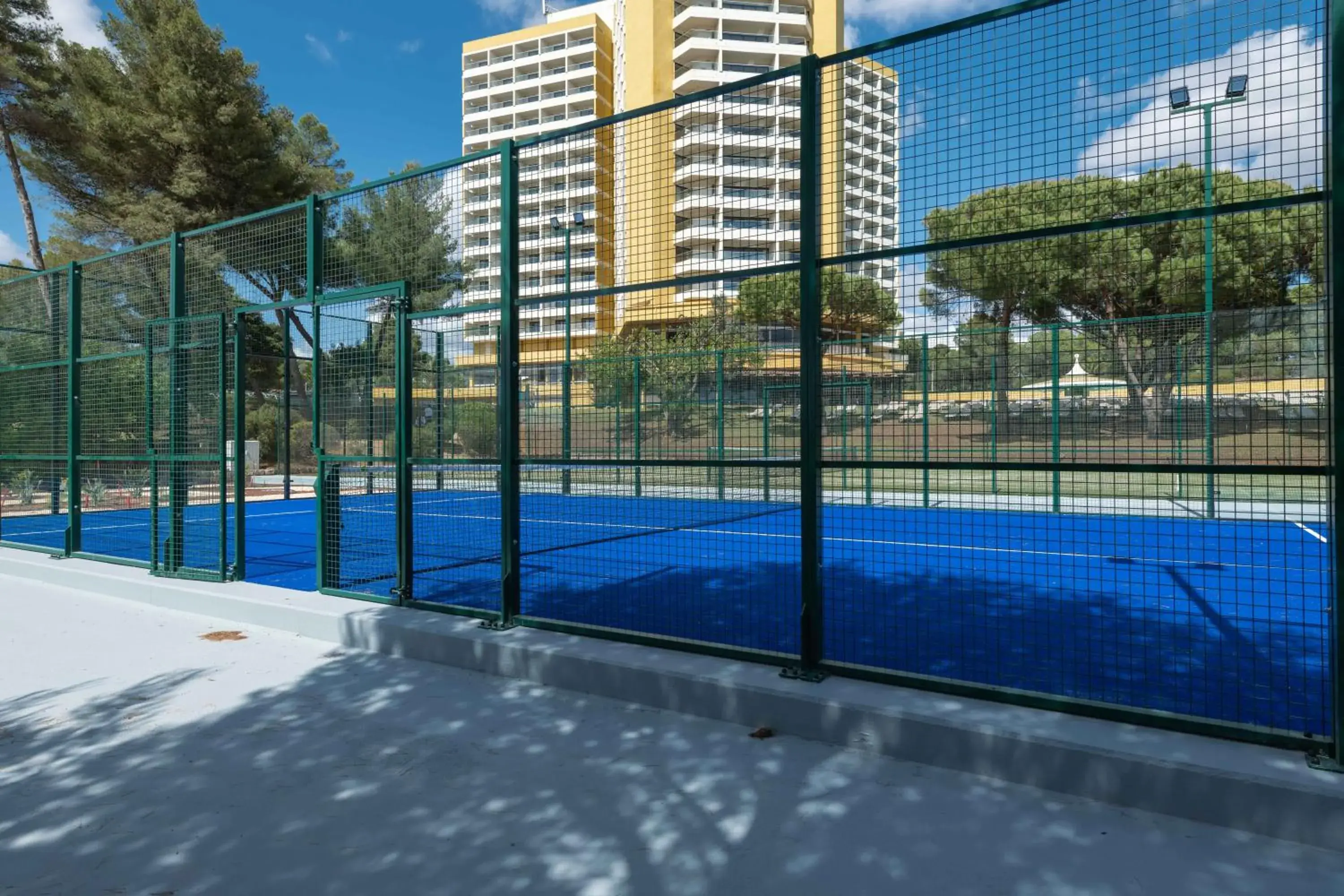 Tennis court, Swimming Pool in Pestana Delfim Beach & Golf Hotel