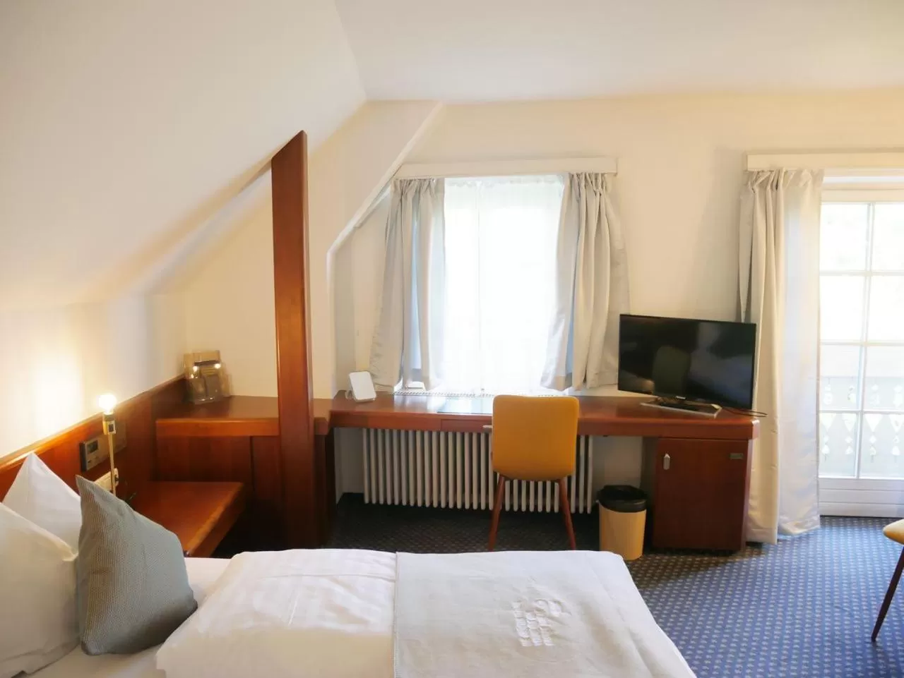 Communal lounge/ TV room, Bed in Stadthaus Valentin