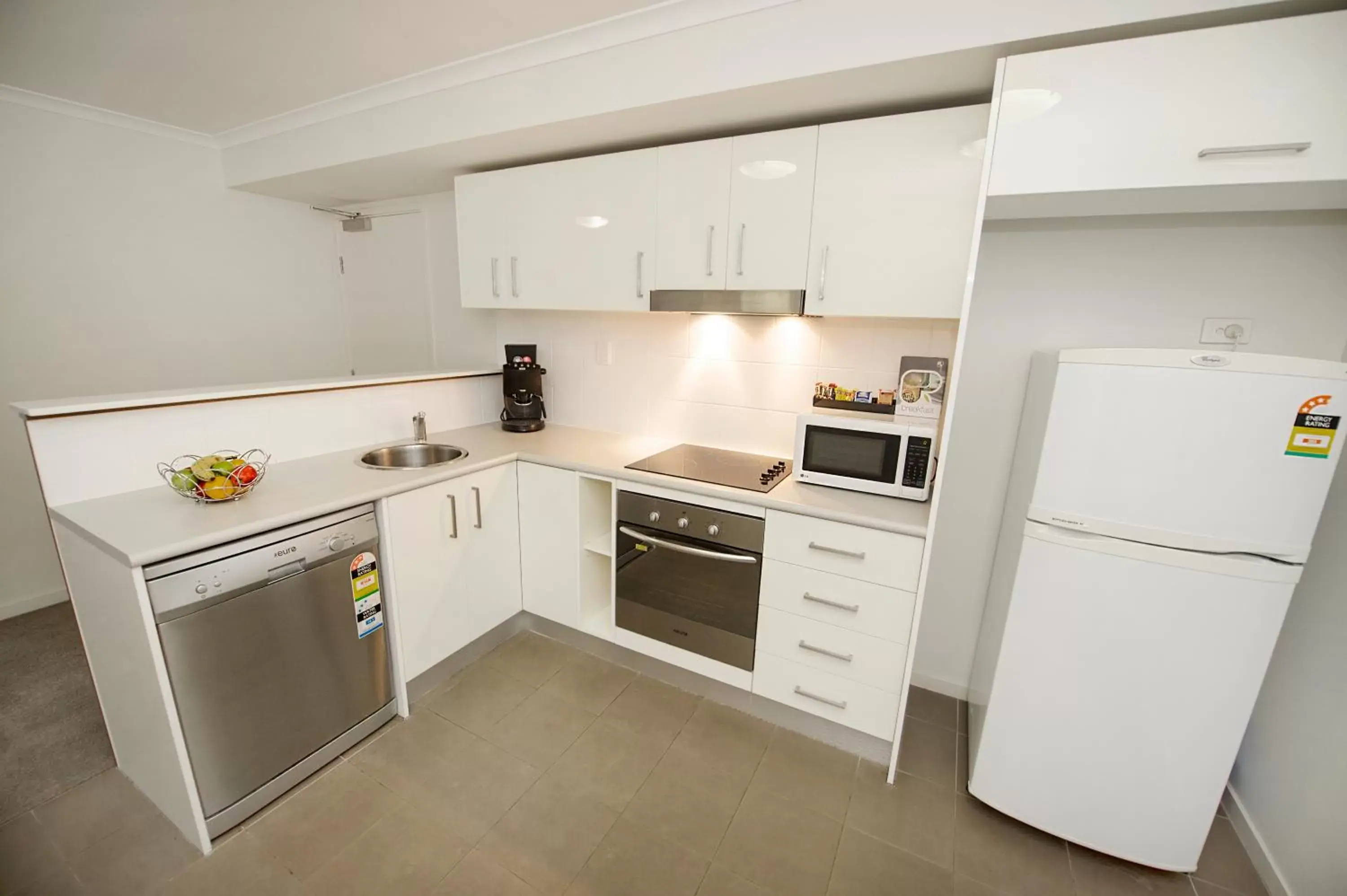 Kitchen or kitchenette, Kitchen/Kitchenette in Gladstone City Central Apartment Hotel