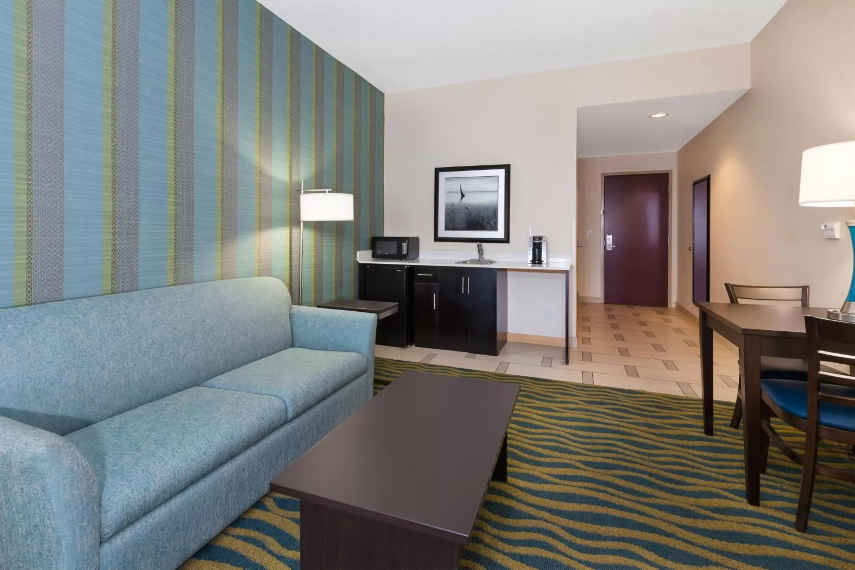 Photo of the whole room, Seating Area in Holiday Inn Express & Suites Southport - Oak Island Area, an IHG Hotel