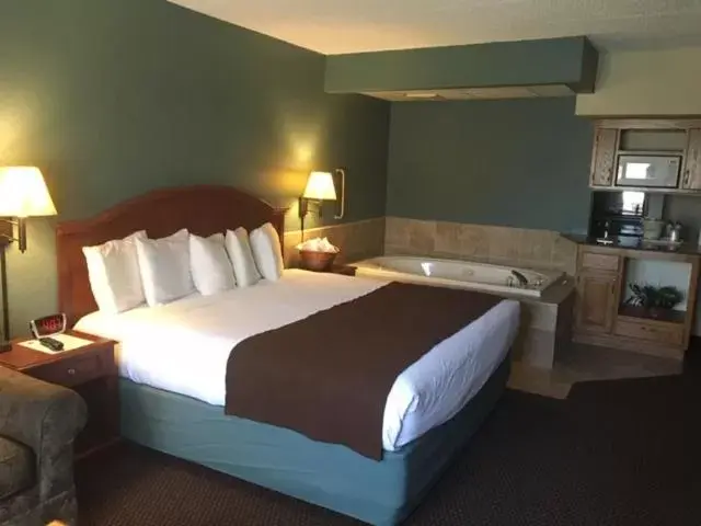 Bed in AmericInn by Wyndham Chippewa Falls