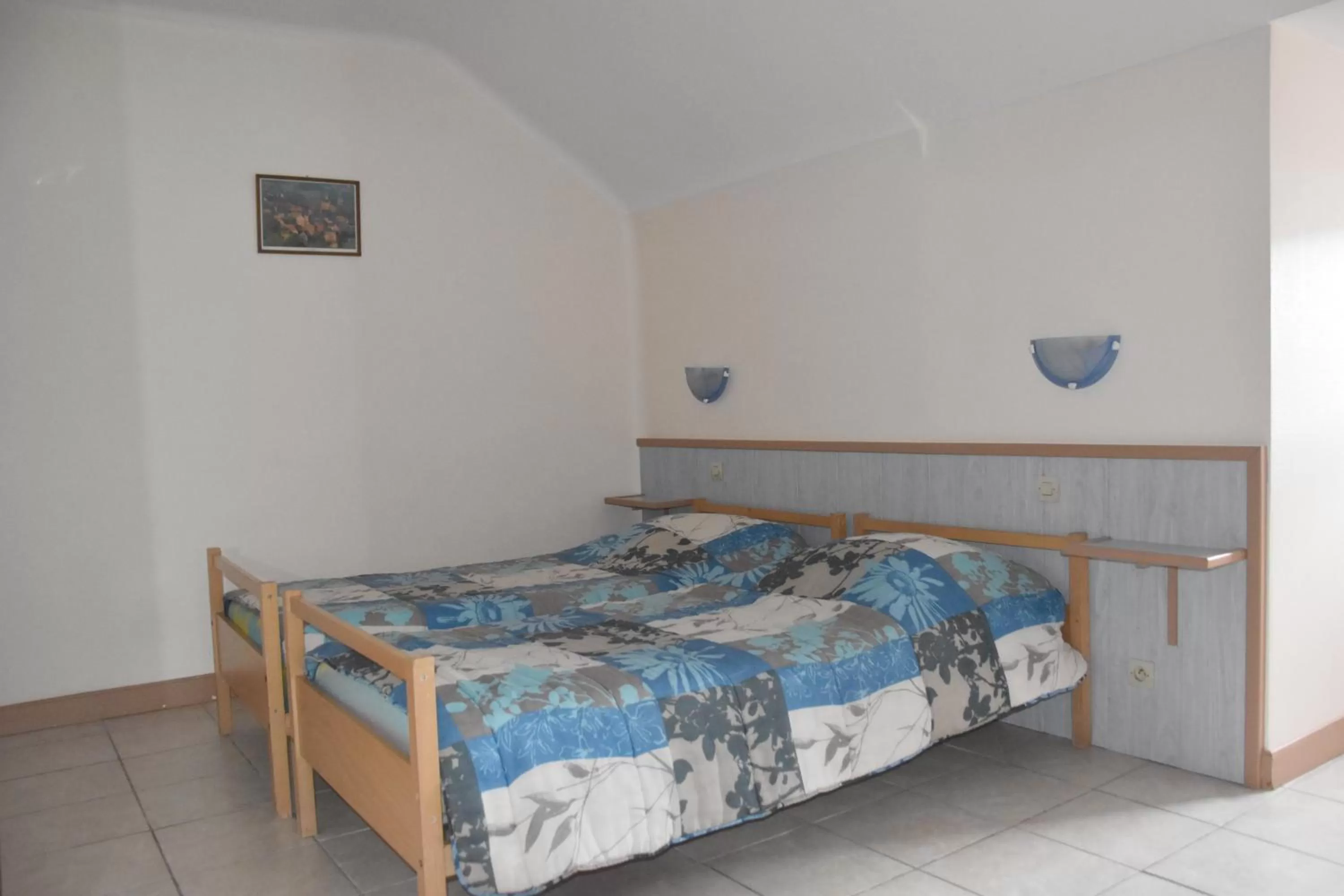 Bed in Hotel Gai Relais