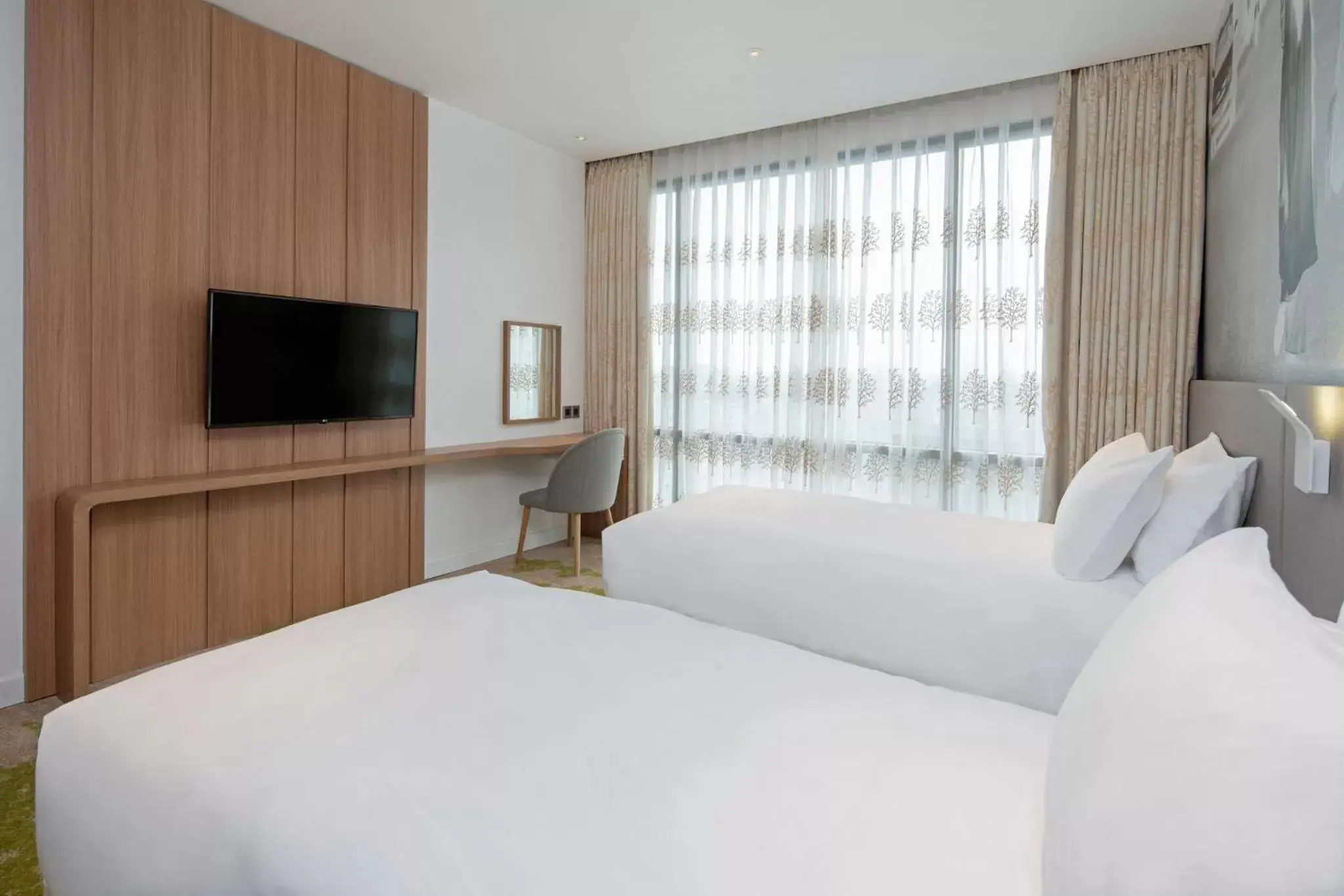 Photo of the whole room, Bed in Holiday Inn & Suites Saigon Airport, an IHG Hotel